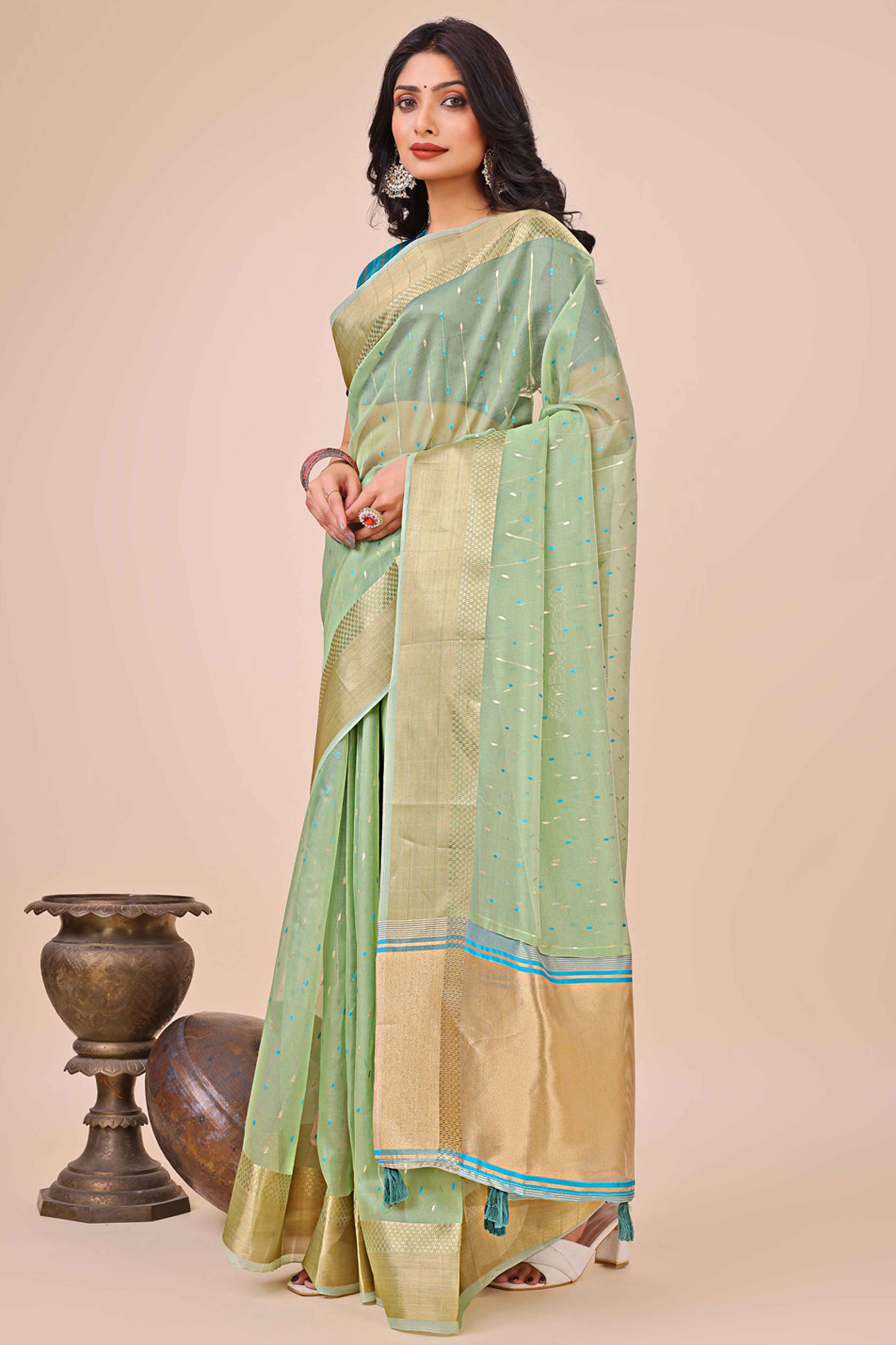 Pista Green Organza Saree Adorned With Fine Zari Weaving & Stylish Tassel Edging