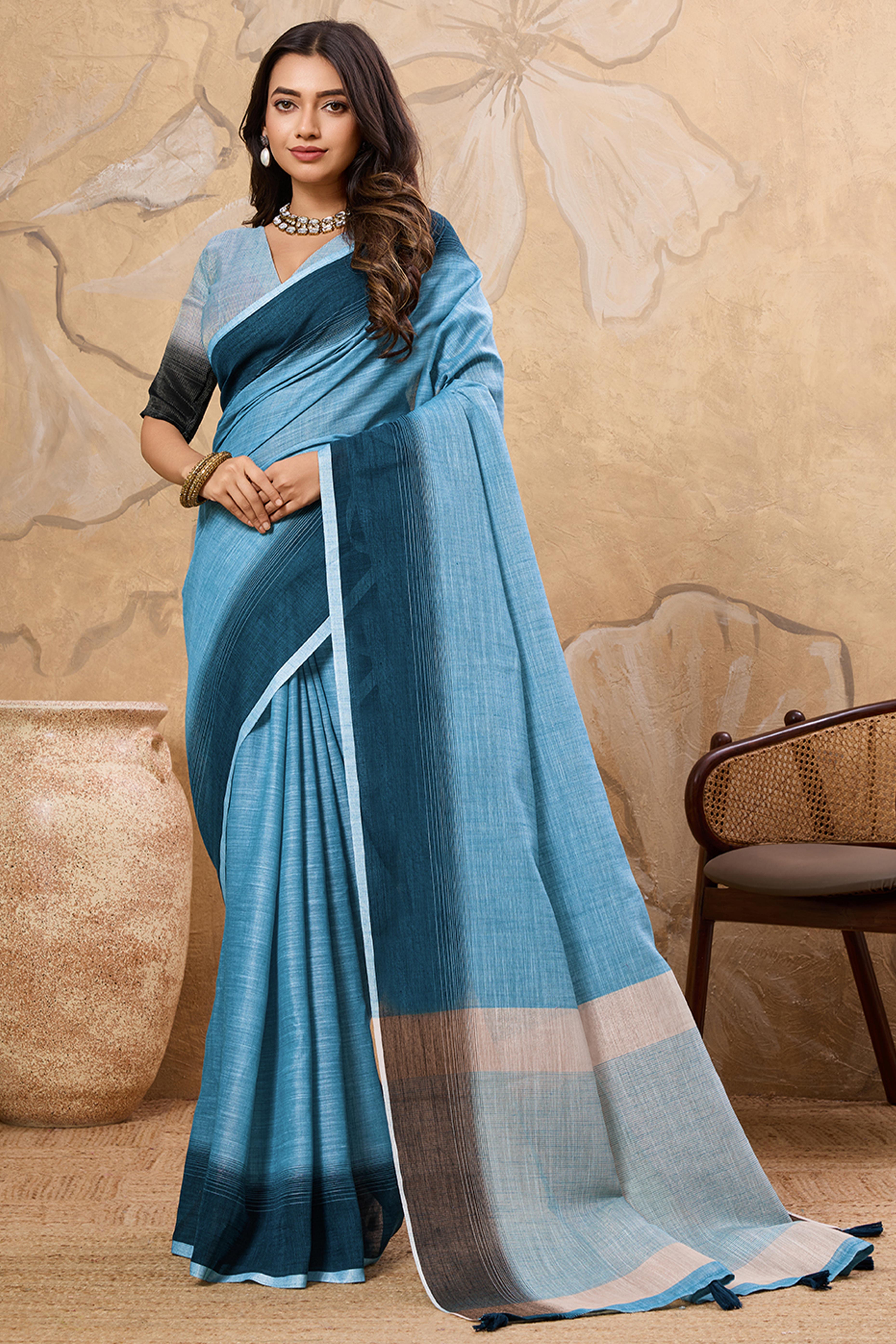 Stylish Sky Blue Linen Saree With Zari Weaving Work & Tassel Pallu Charm