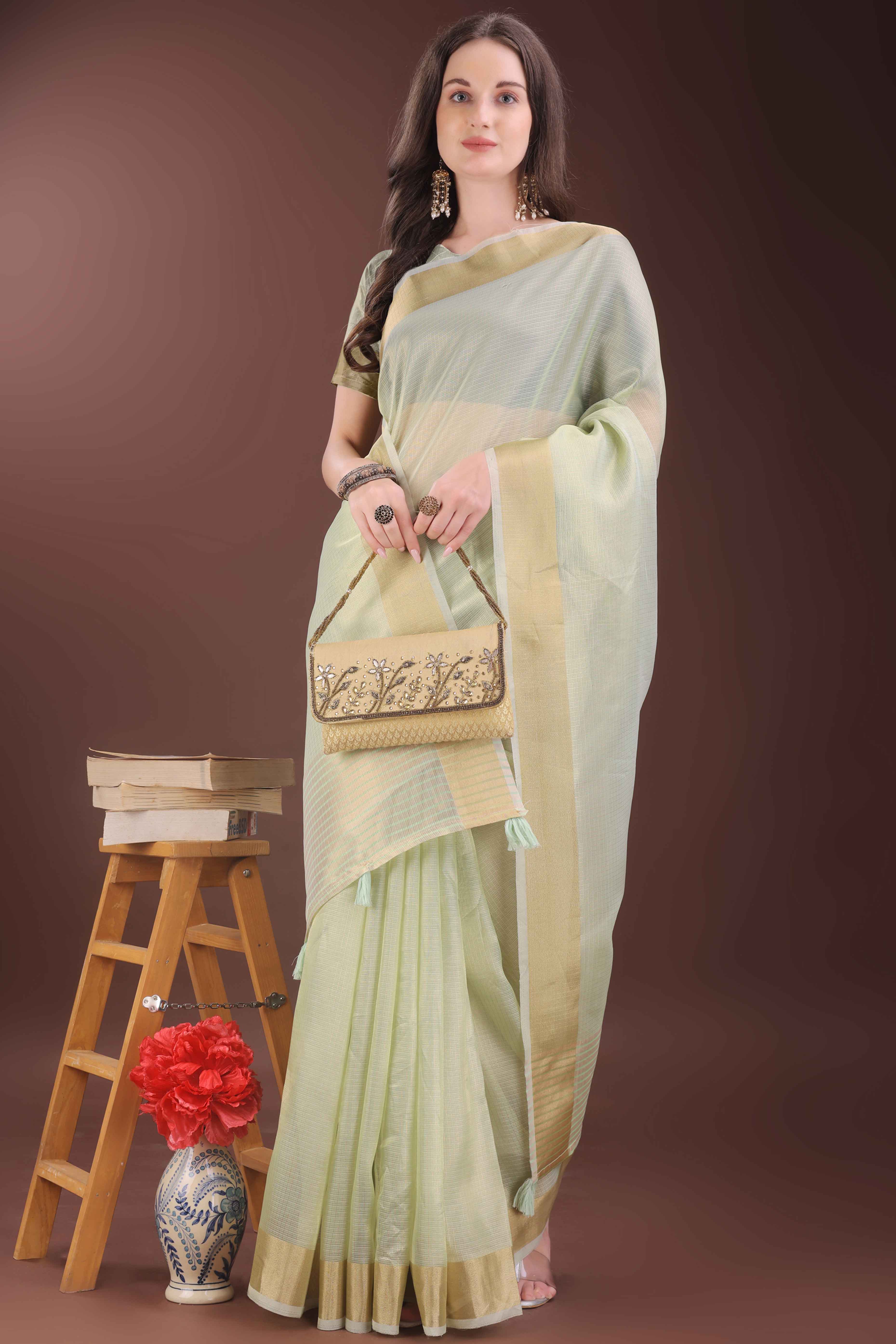 Light Green Zari Woven Organza Saree With Graceful Tassel Border