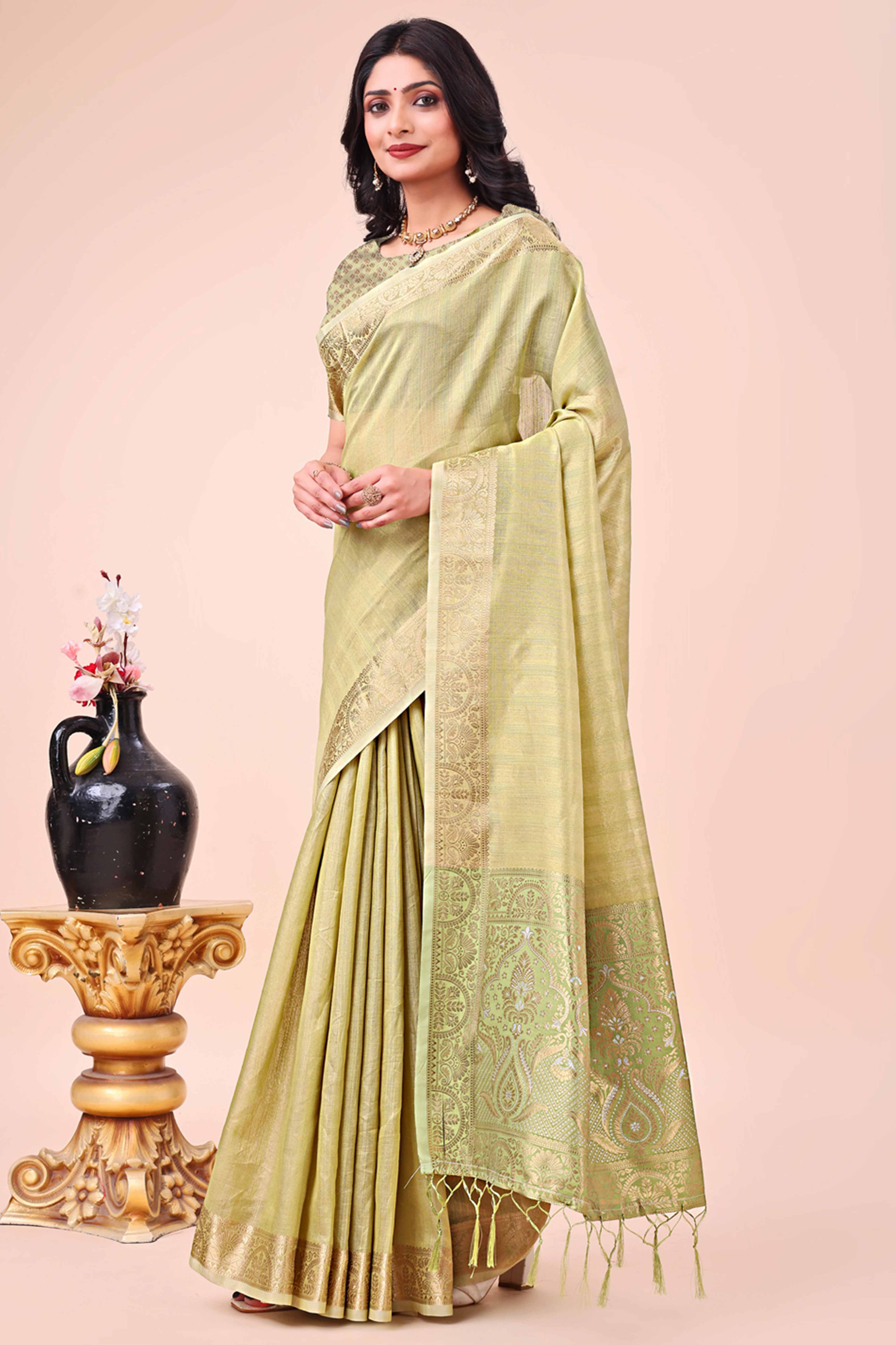 Green Organza Saree With Floral Zari Weave & Tassel Accents