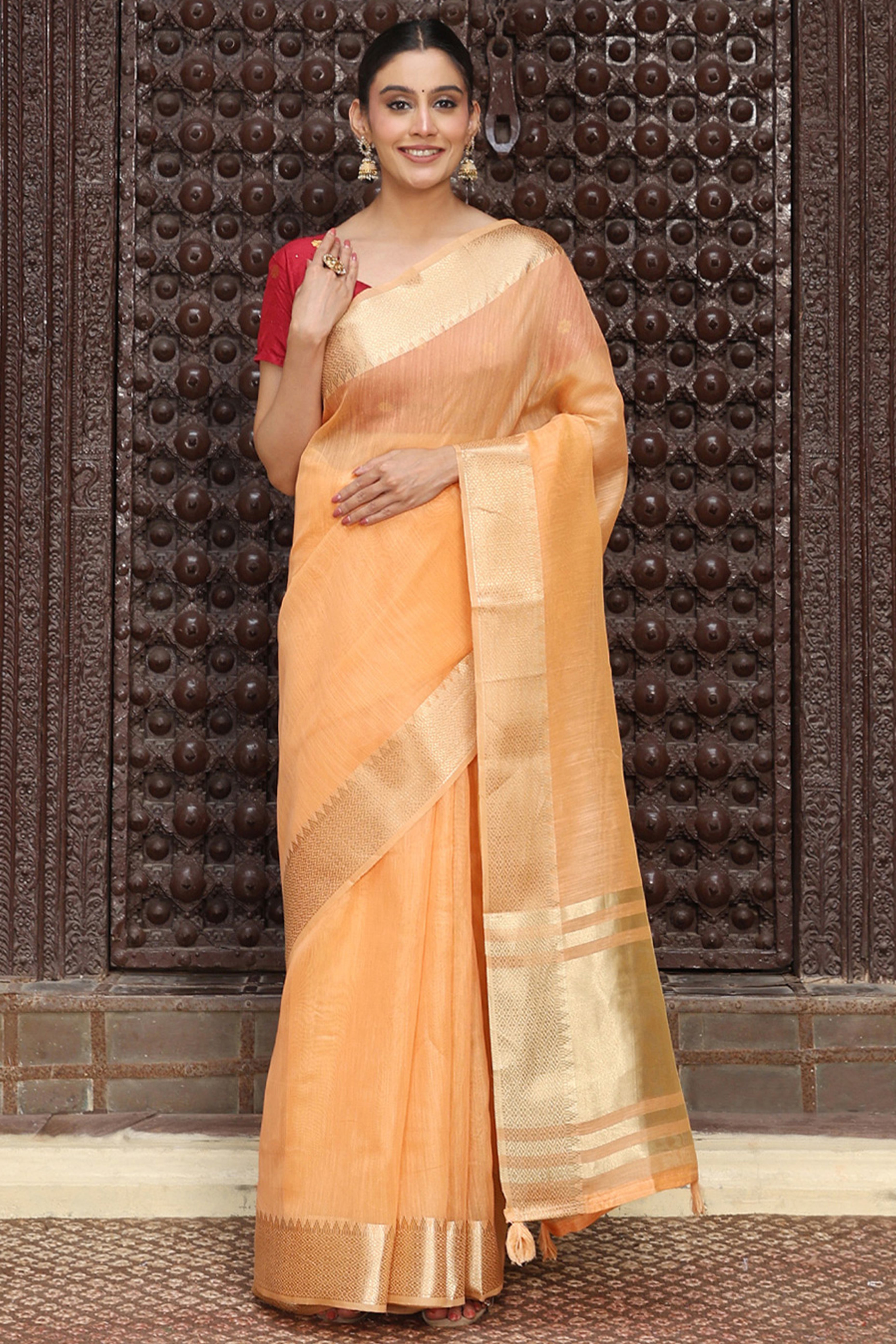 Trendy Orange Cotton Blend Saree Showcasing Elegant Zari Weaving & Tassel Border Pallu
