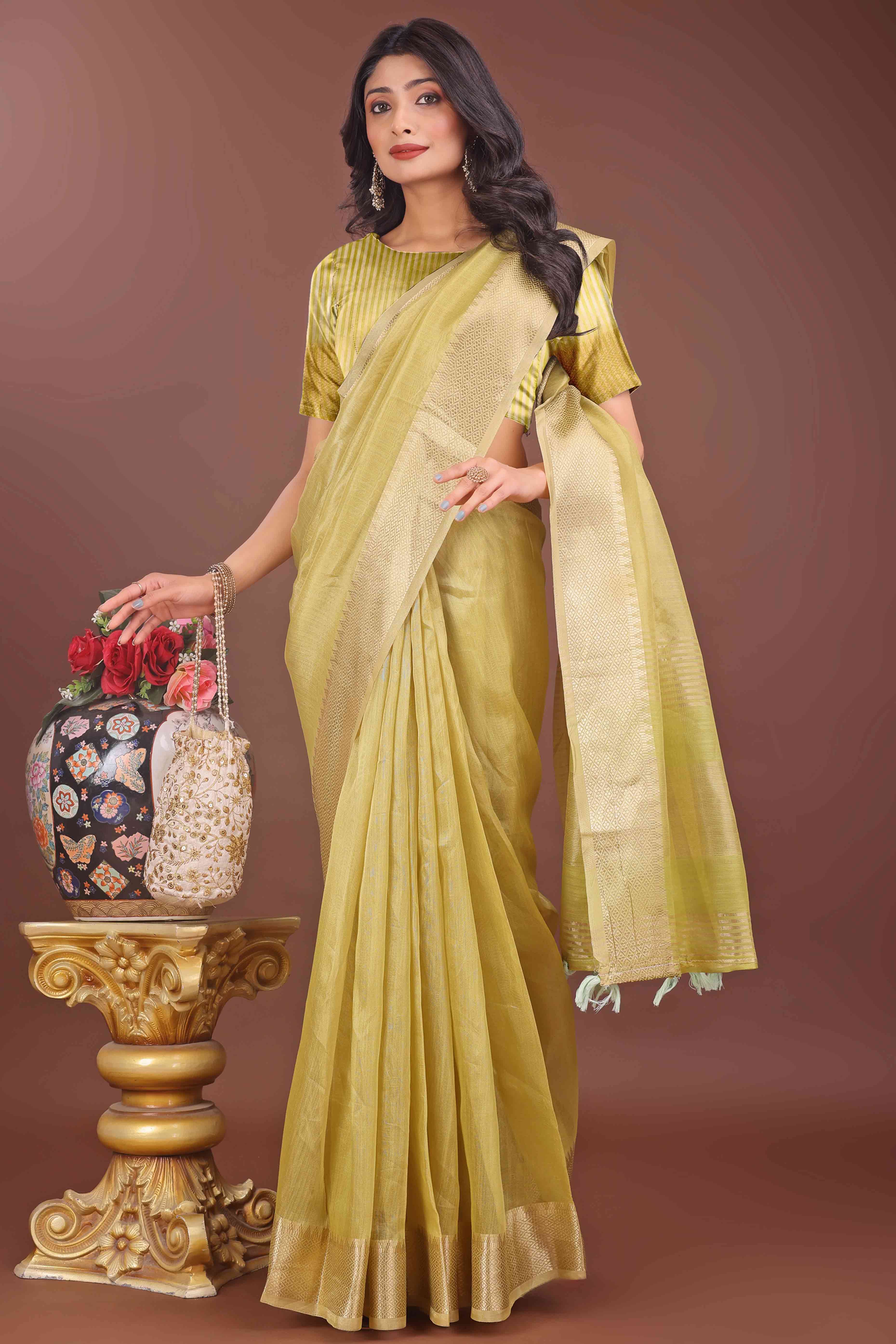Green Solid With Zari Woven Organza Saree With Tassel Border