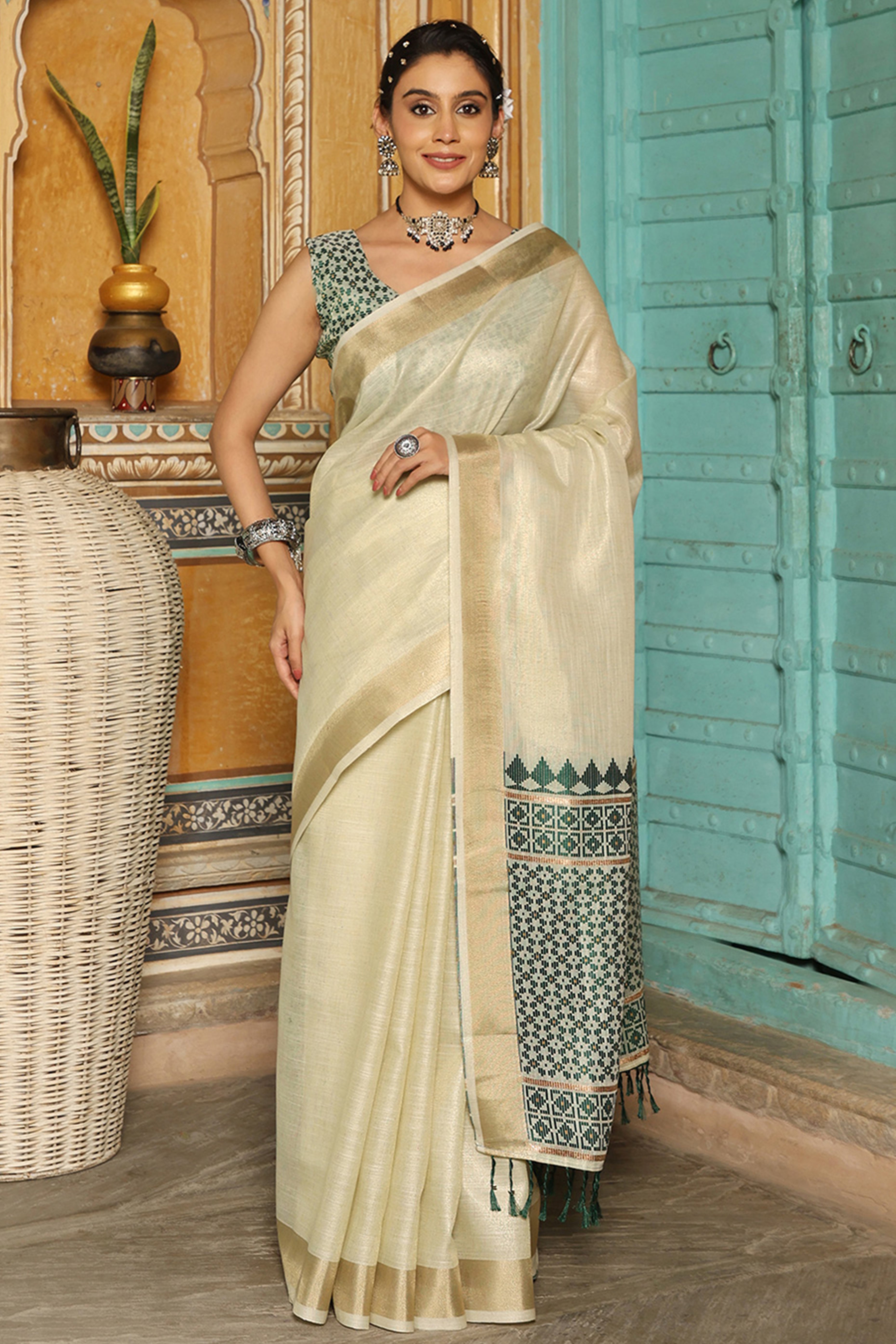 Minimalist Cream Linen Saree with Elegant Green Pallu in Handloom Weave Look