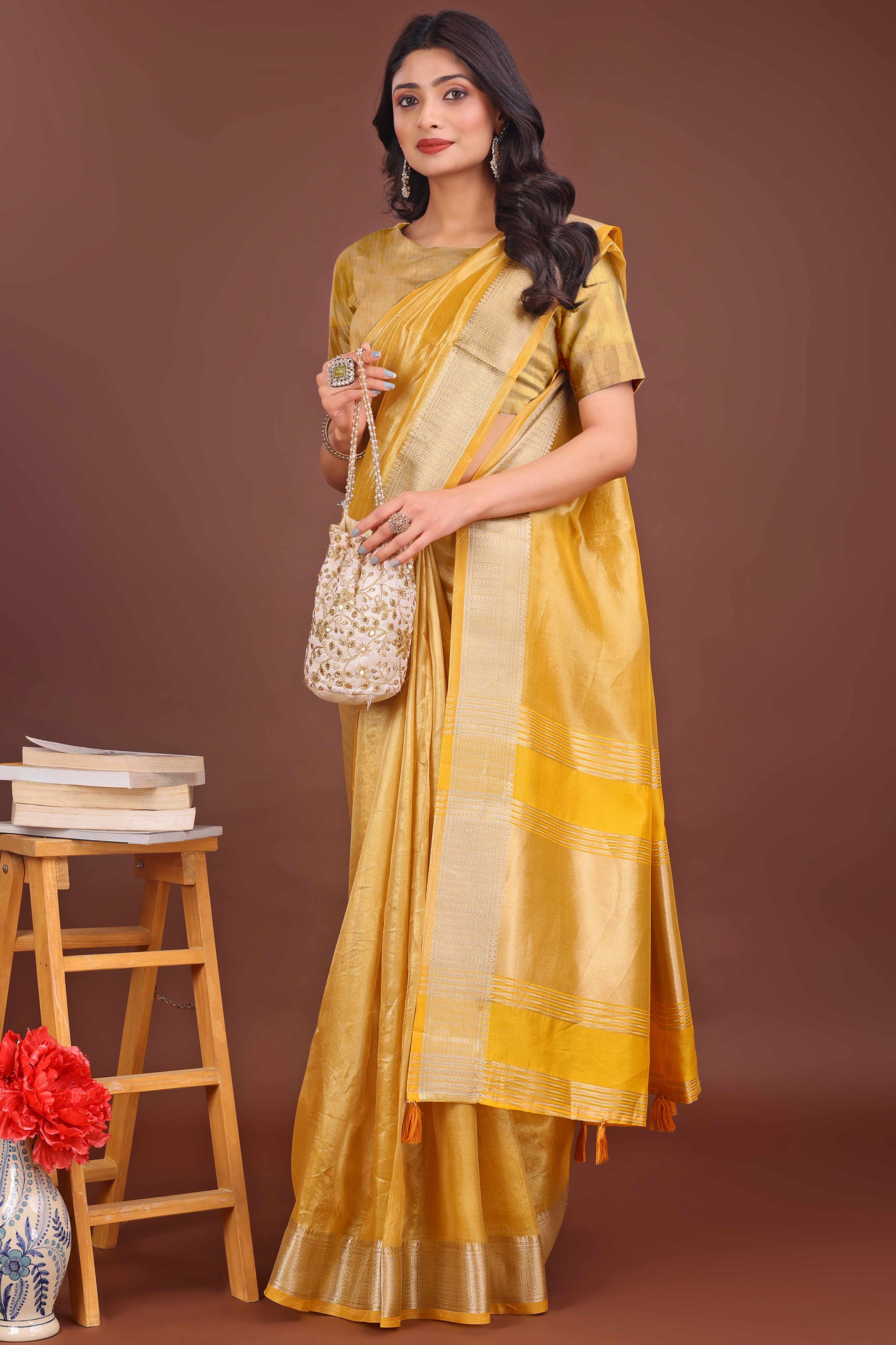 Yellow Organza Solid Saree With Lustrous Zari Weave &  Delicate Tassels