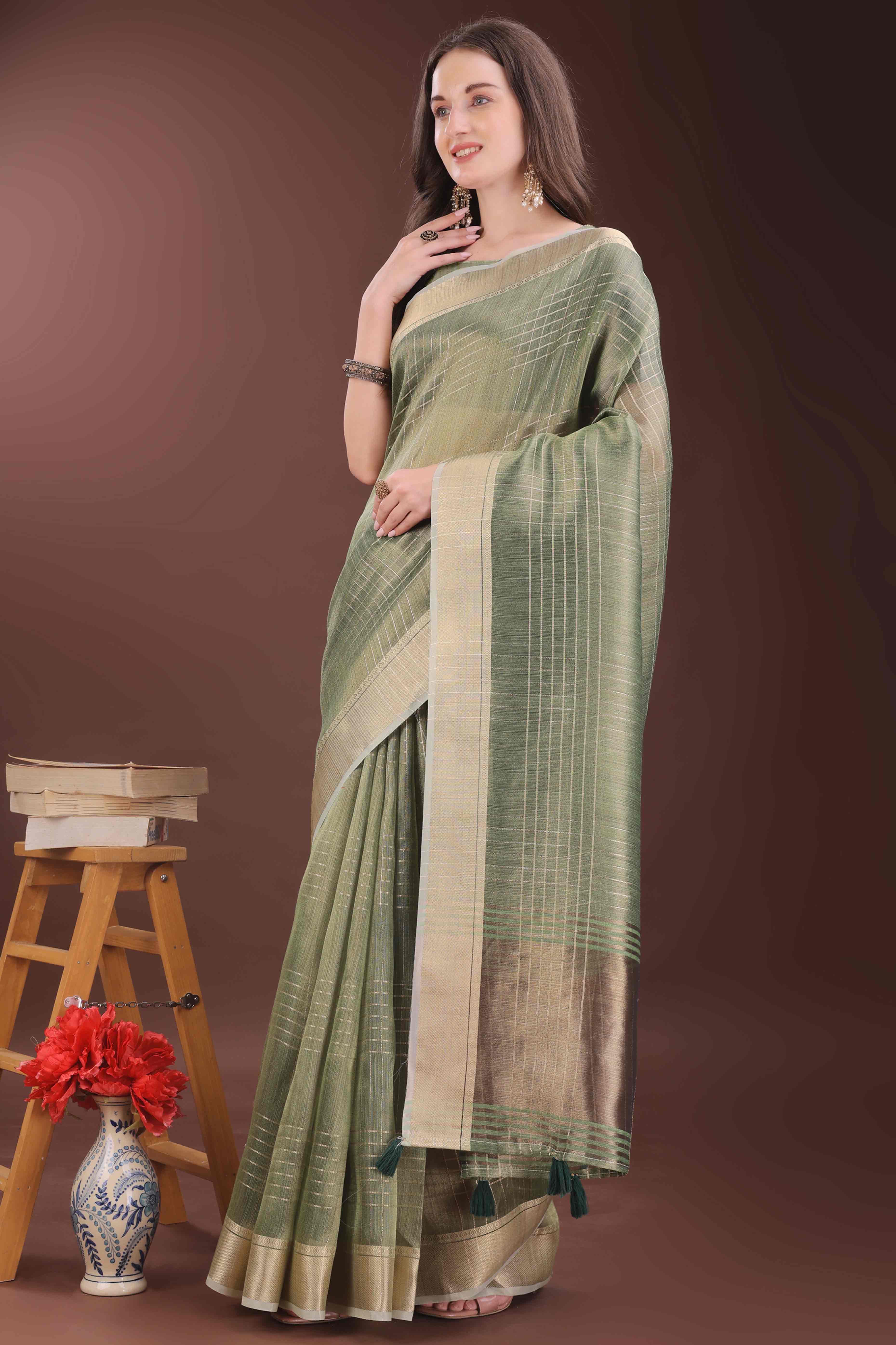 Green Organza Saree With Zari Weaving Check Patterns & Elegant Tassel Accents