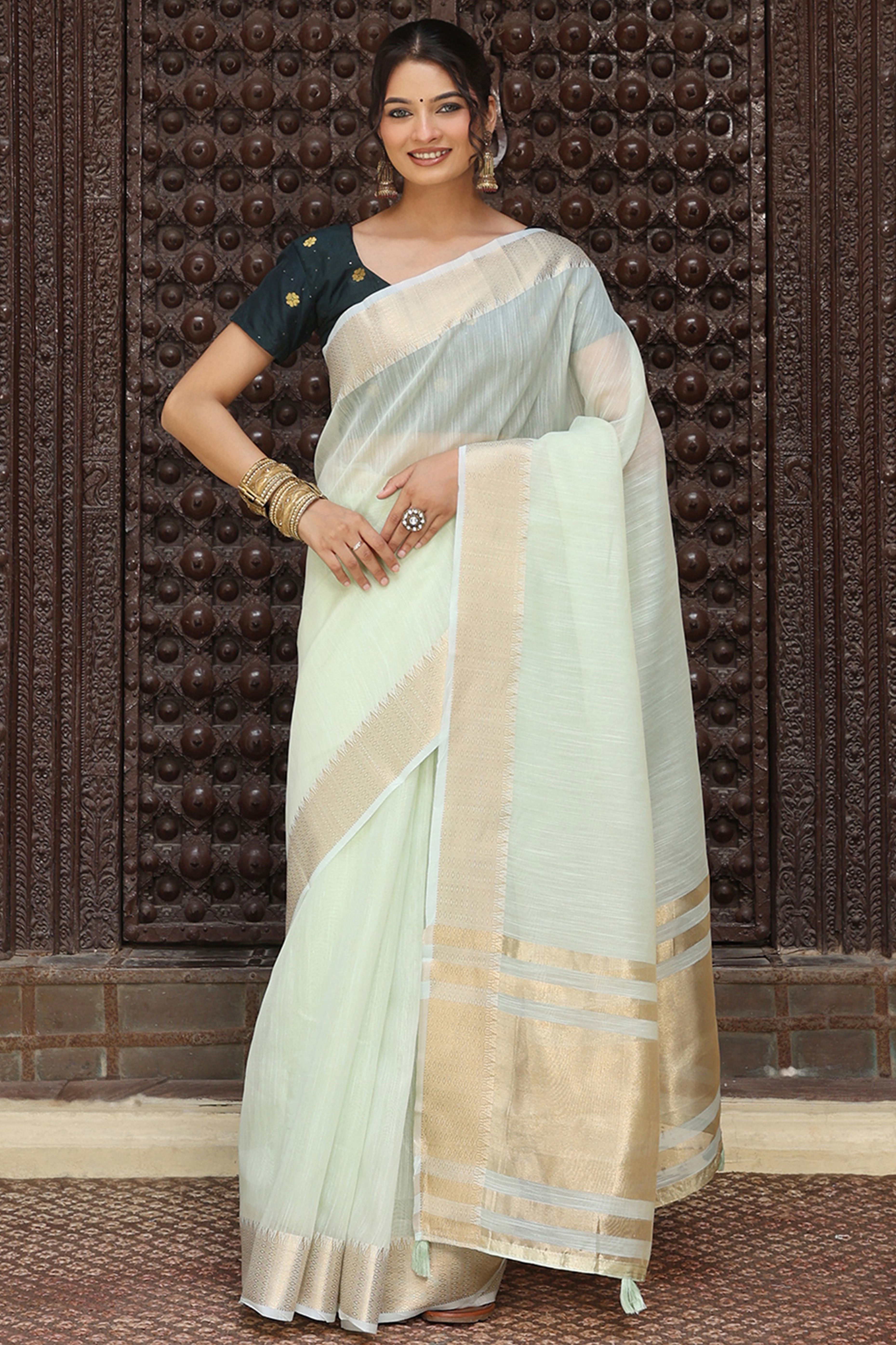 Charming Light Sea Green Zari Weaving Cotton Blend Saree Adorned With Stylish Tassel Detailing