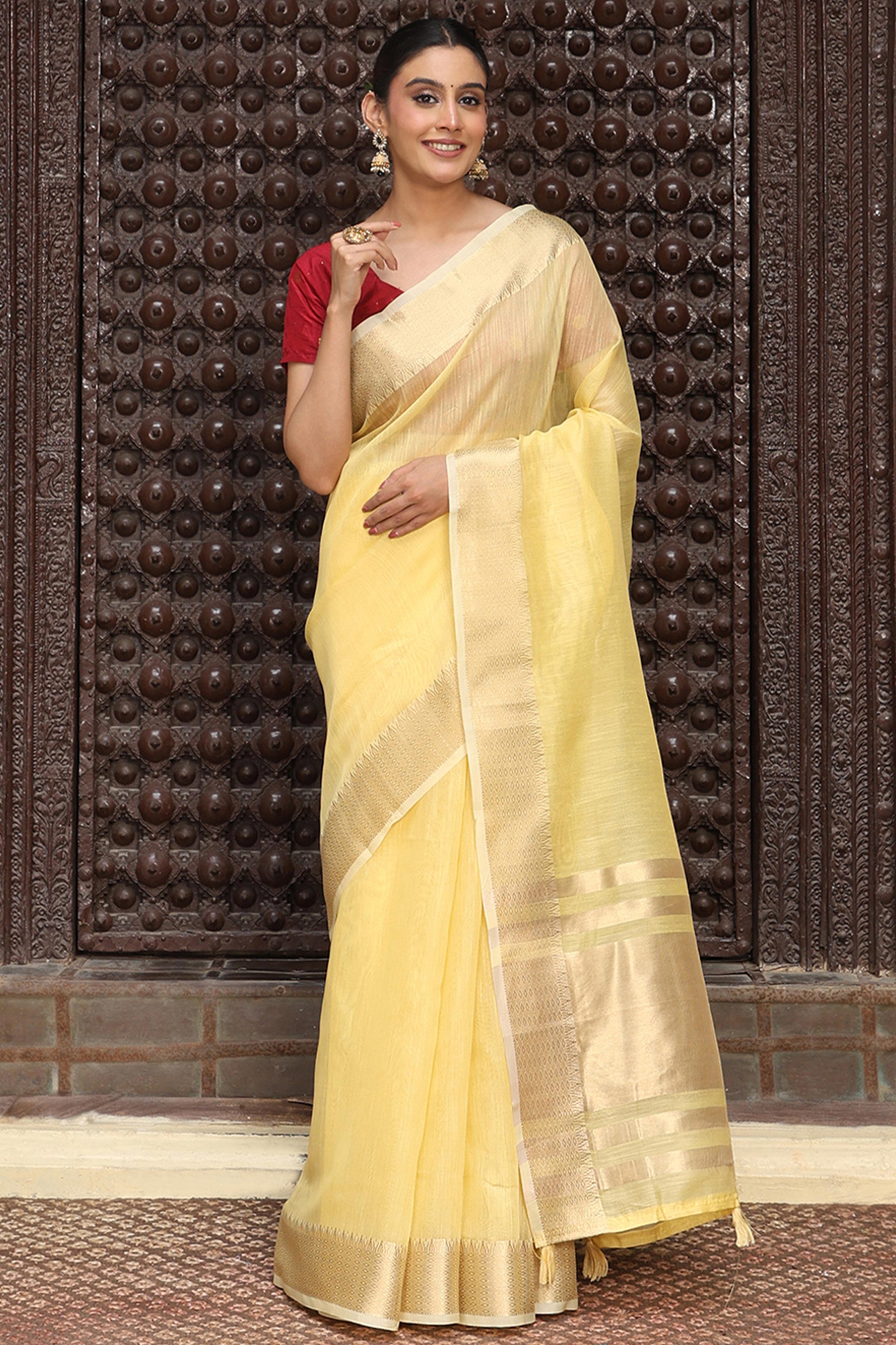 Charming Yellow Zari Weaving Cotton Blend Saree Adorned With Stylish Tassel Detailing