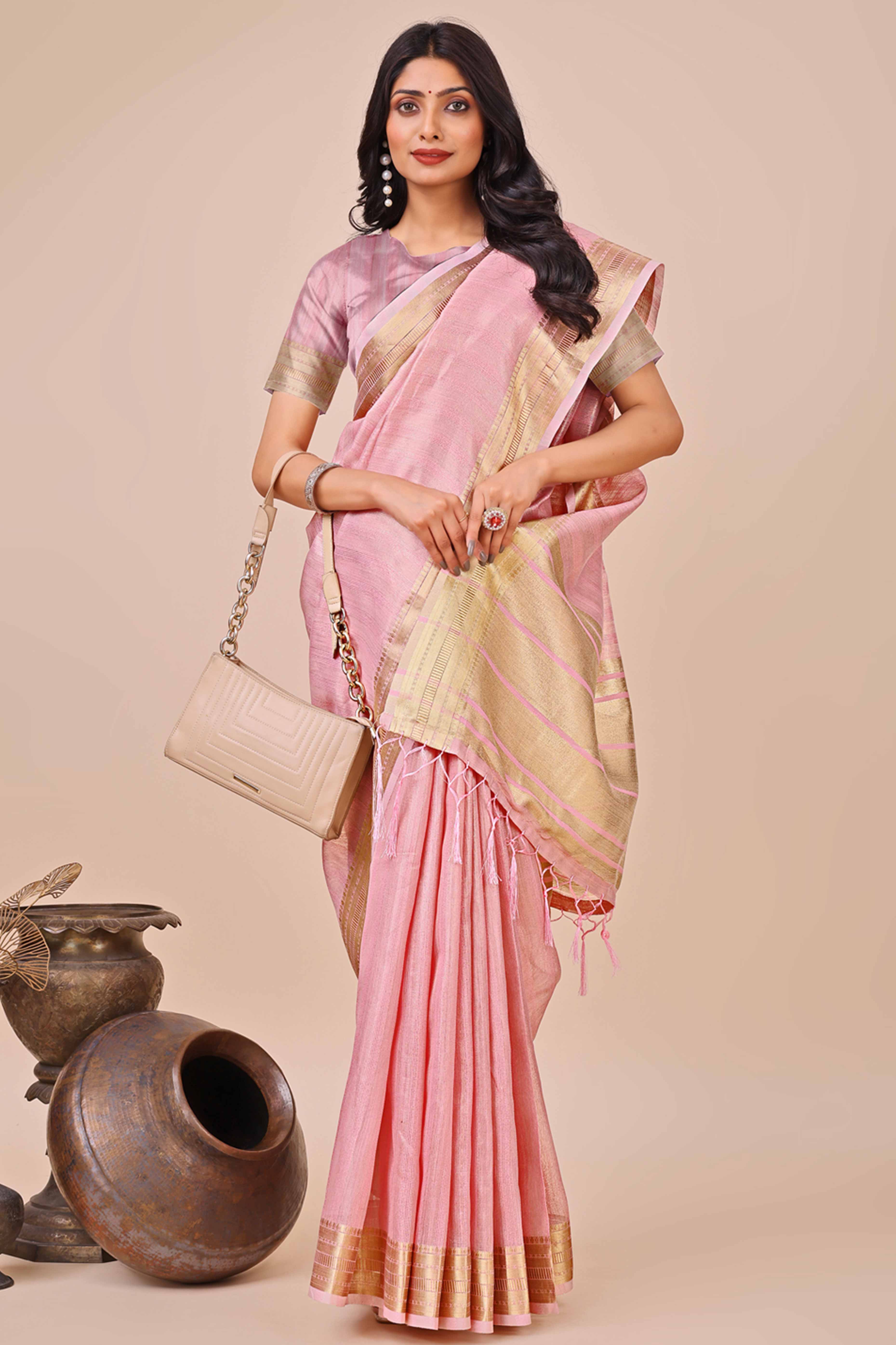 Pink Organza Saree With Intricate Weave & Elegant Tassel Accents