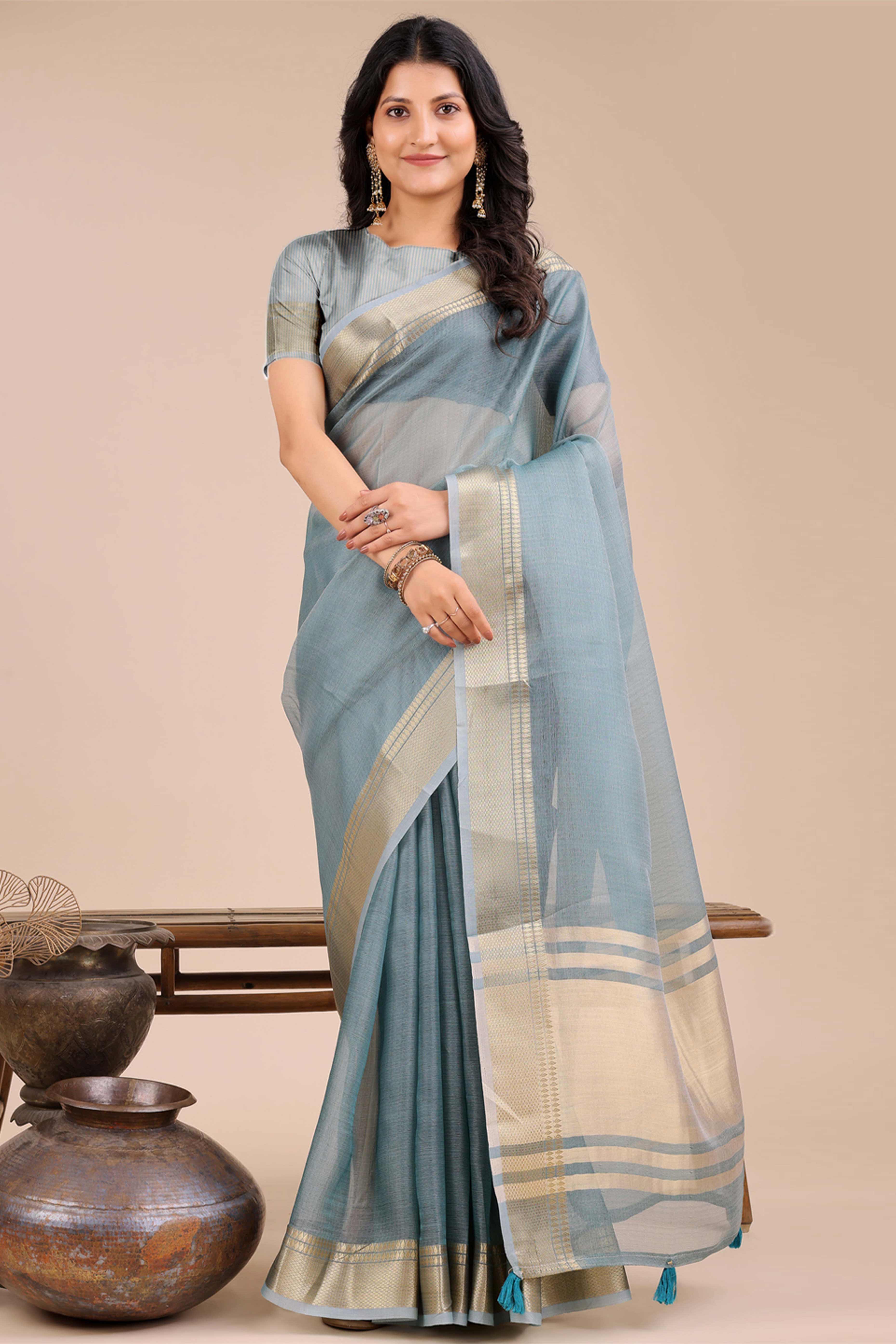 Soft Sea Green Organza Saree with Detailed Zari Woven Edging