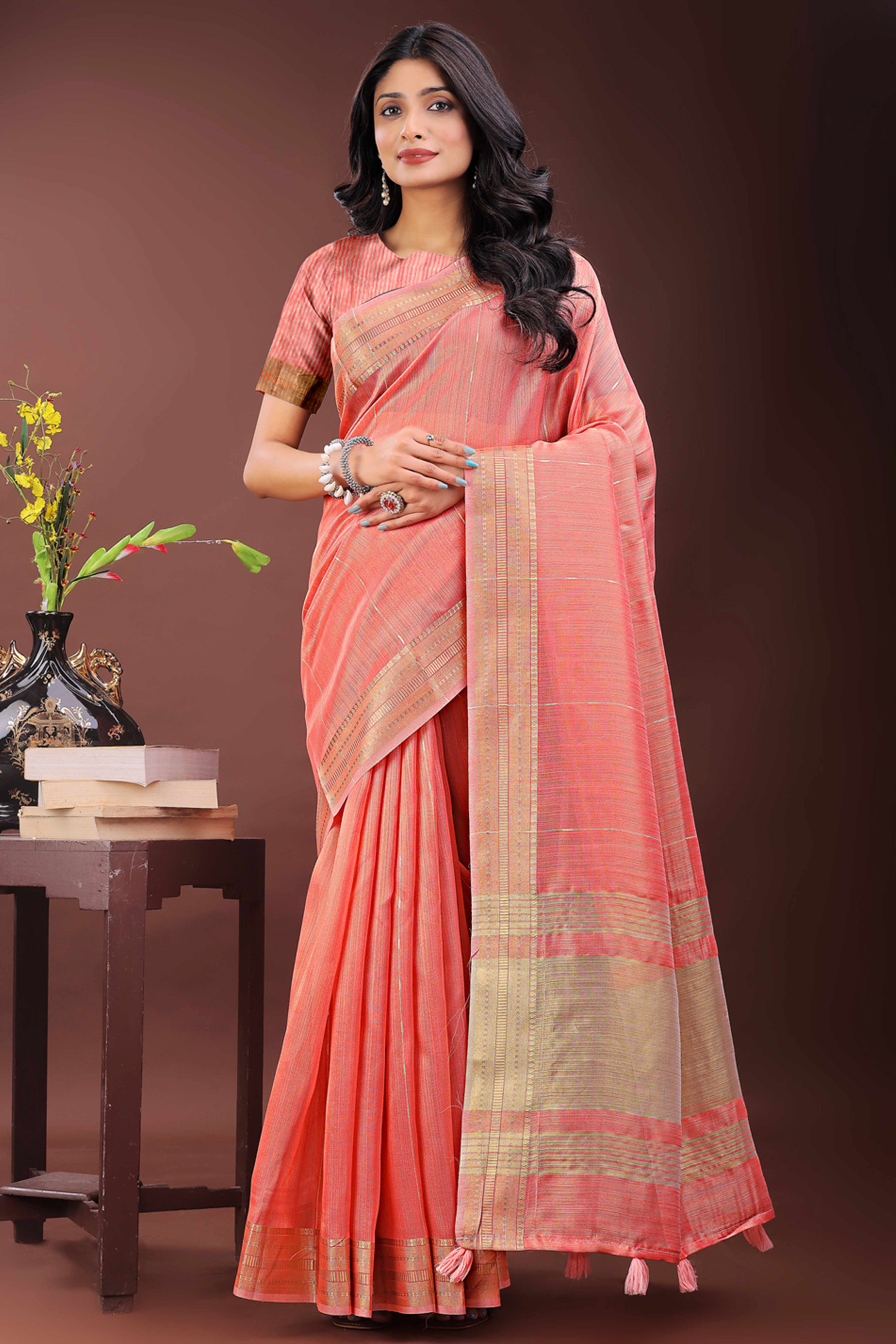 Coral Pink Organza Saree Adorned With Zari Weave & Tassel Edges