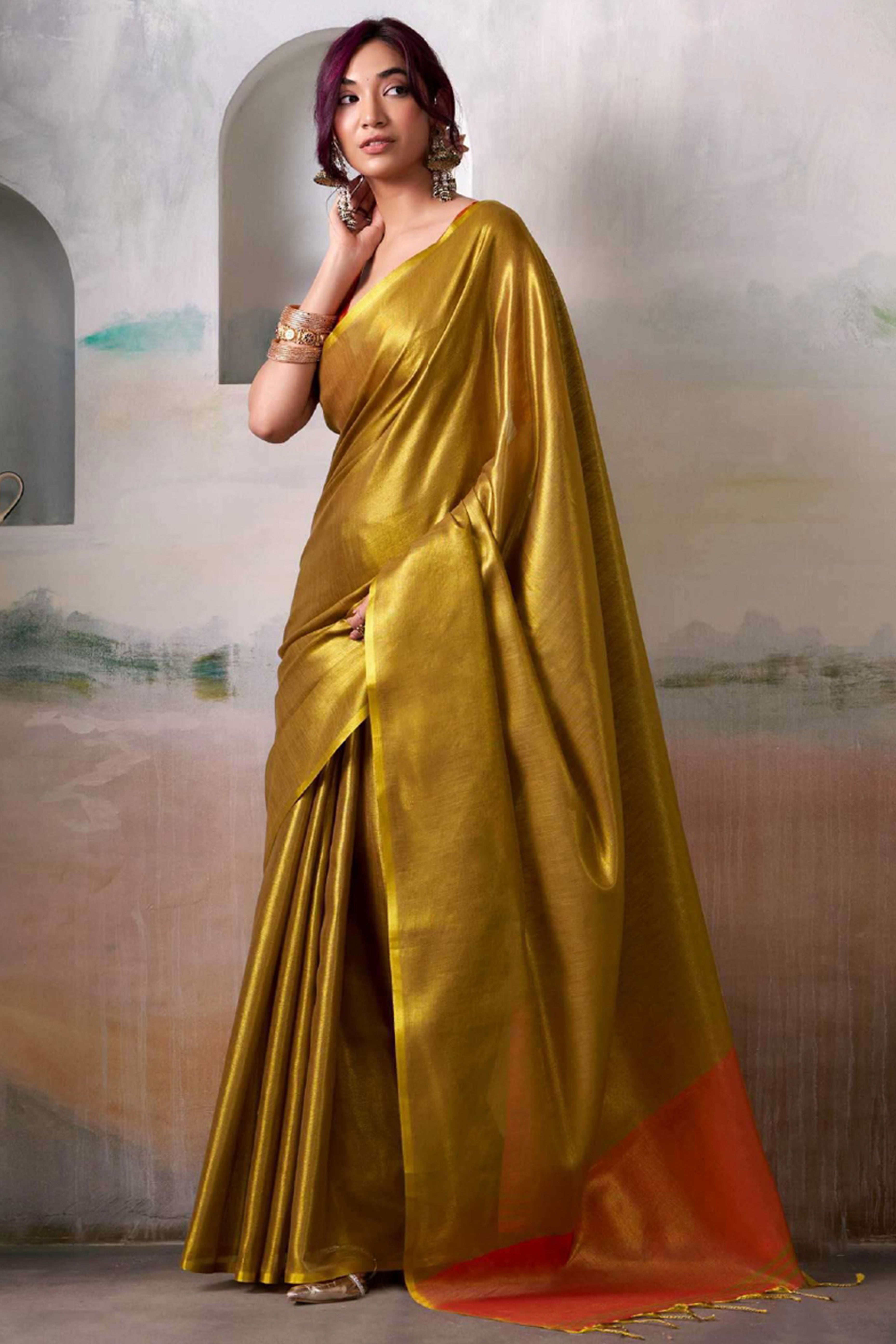 Graceful Dark Mustard Tissue Silk Blend Saree Adorned with Intricate Zari Weaving & Tassel Pallu