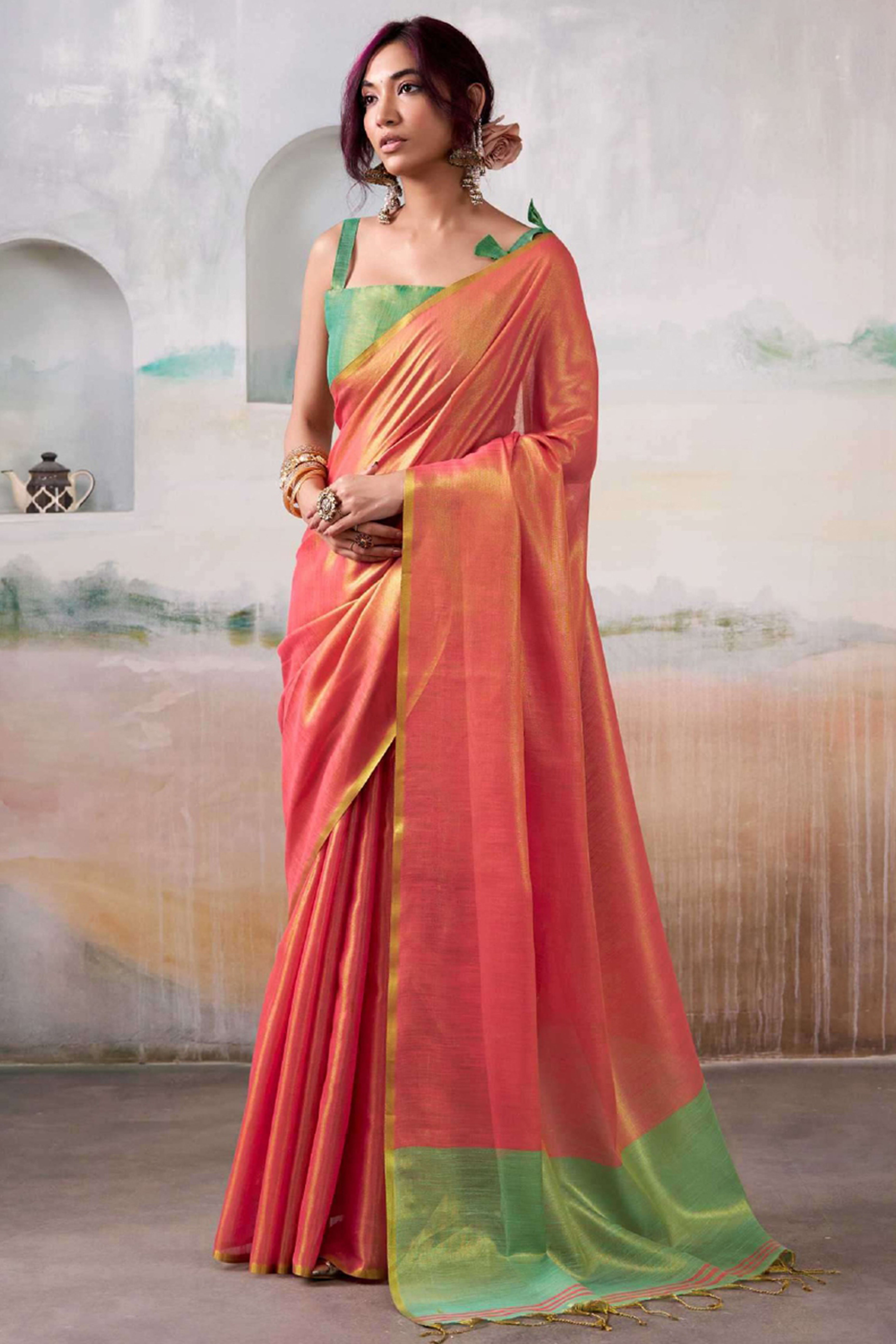 Graceful Pink Tissue Silk Blend Saree Adorned with Intricate Zari Weaving & Tassel Pallu
