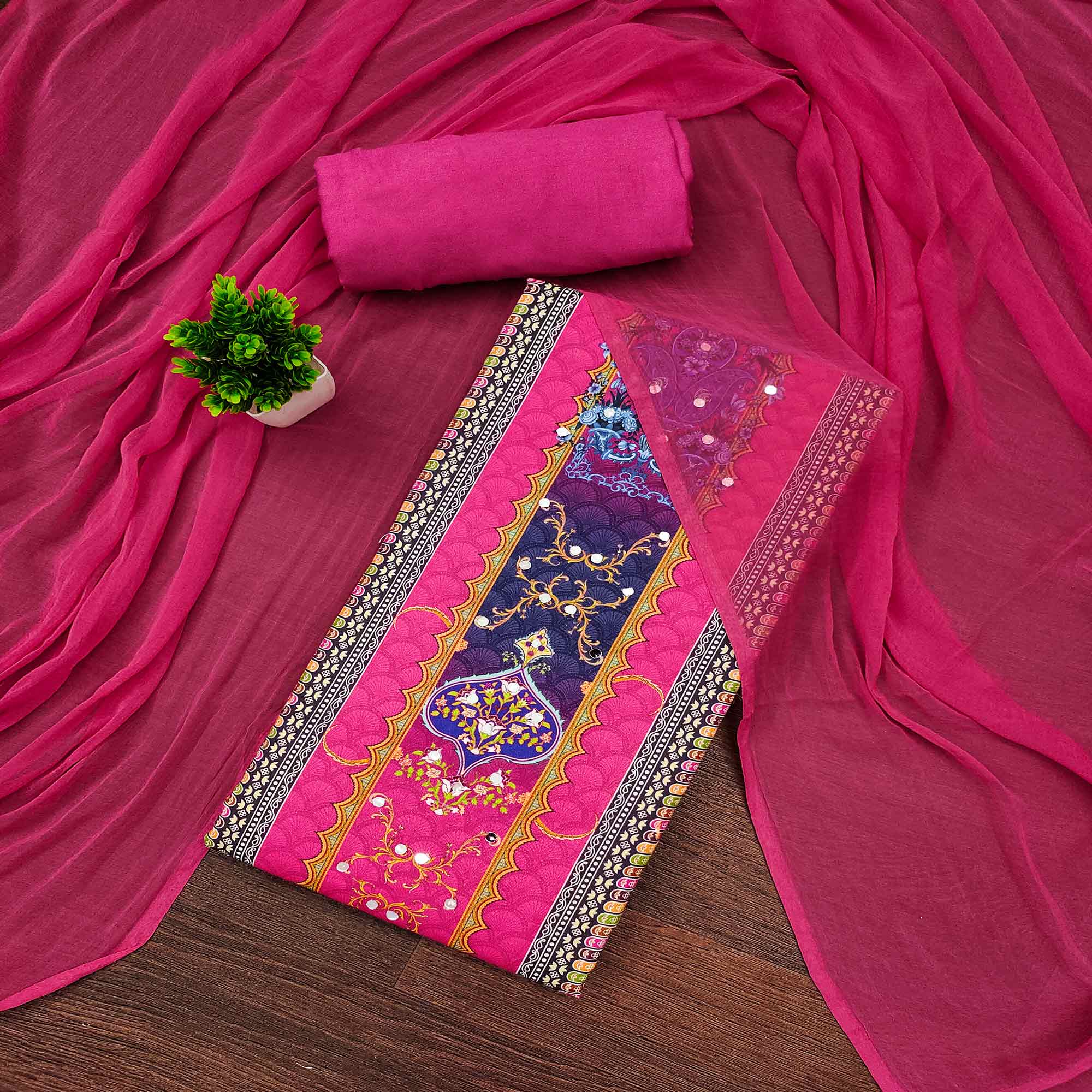 Stylish Rani Pink Floral Digital Printed Rayon Dress Material Adorned With Mirror Embellishments