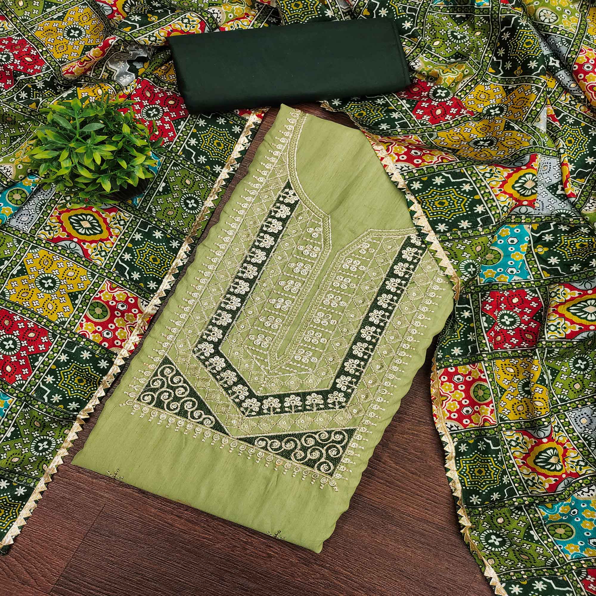 Stylish Green Cotton Blend Dress Material Enriched With Floral Embroidery & Sequins Work
