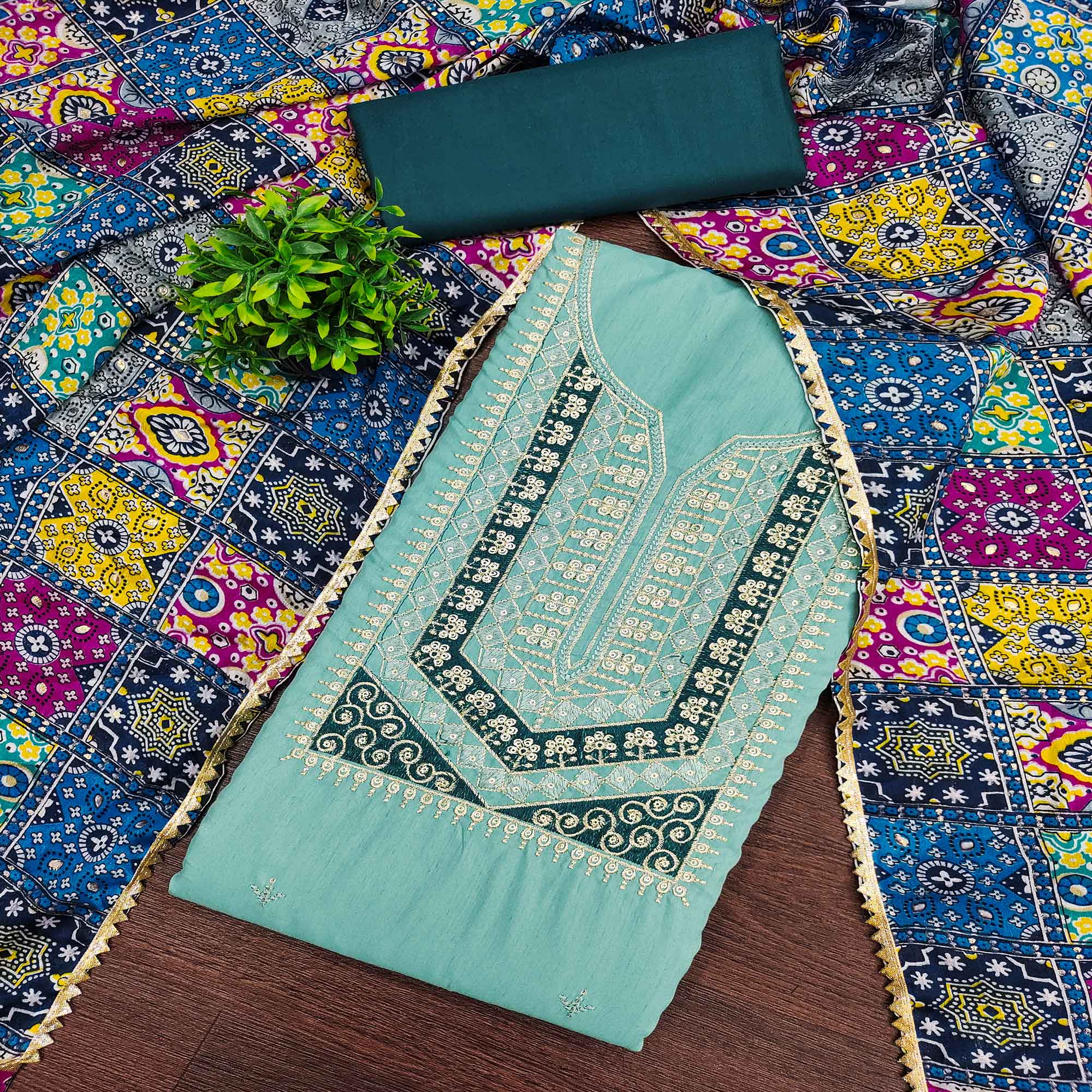 Stylish Turquoise Cotton Blend Dress Material Enriched With Floral Embroidery & Sequins Work