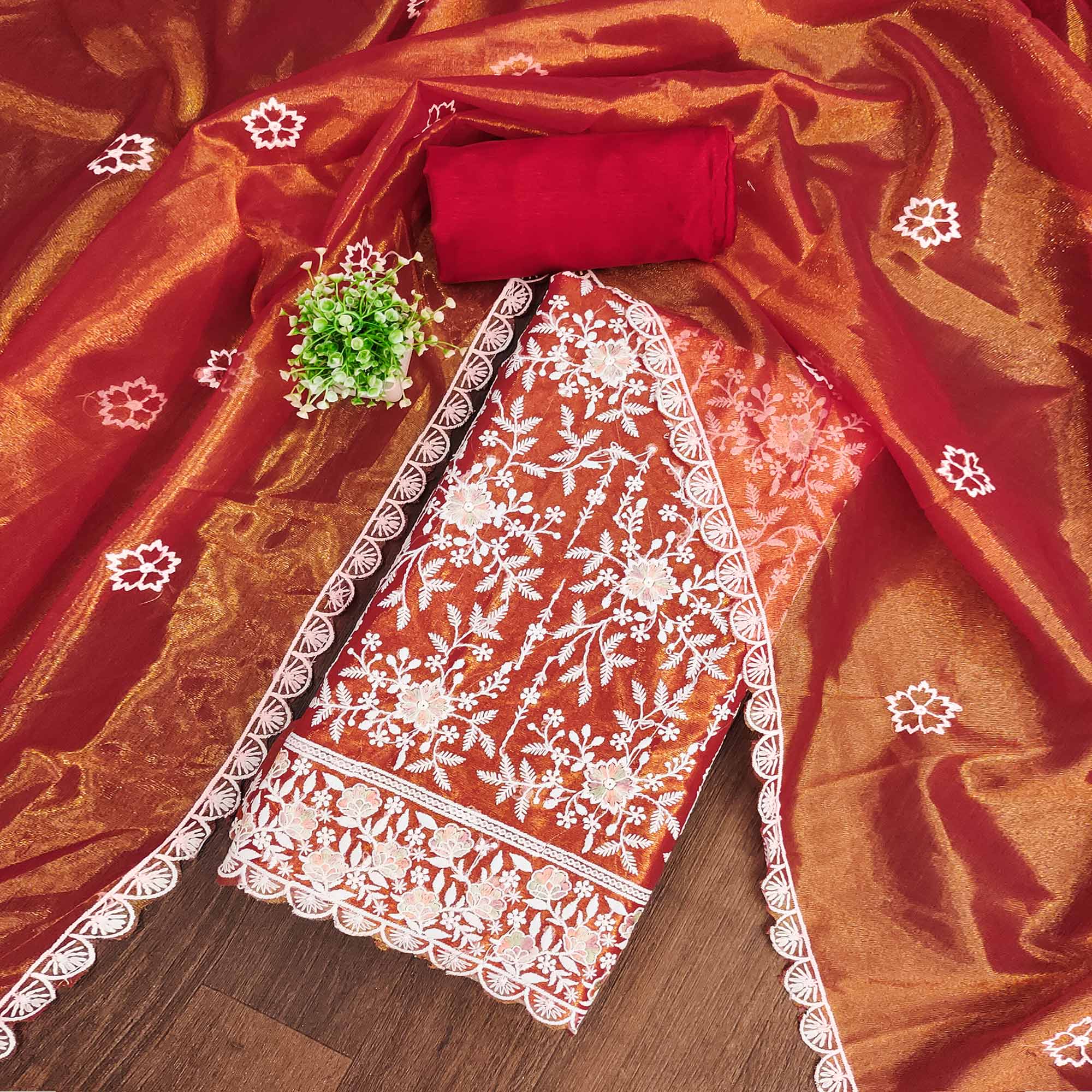 Stunning Rust Dress Material Adorned with Intricate Floral Embroidery