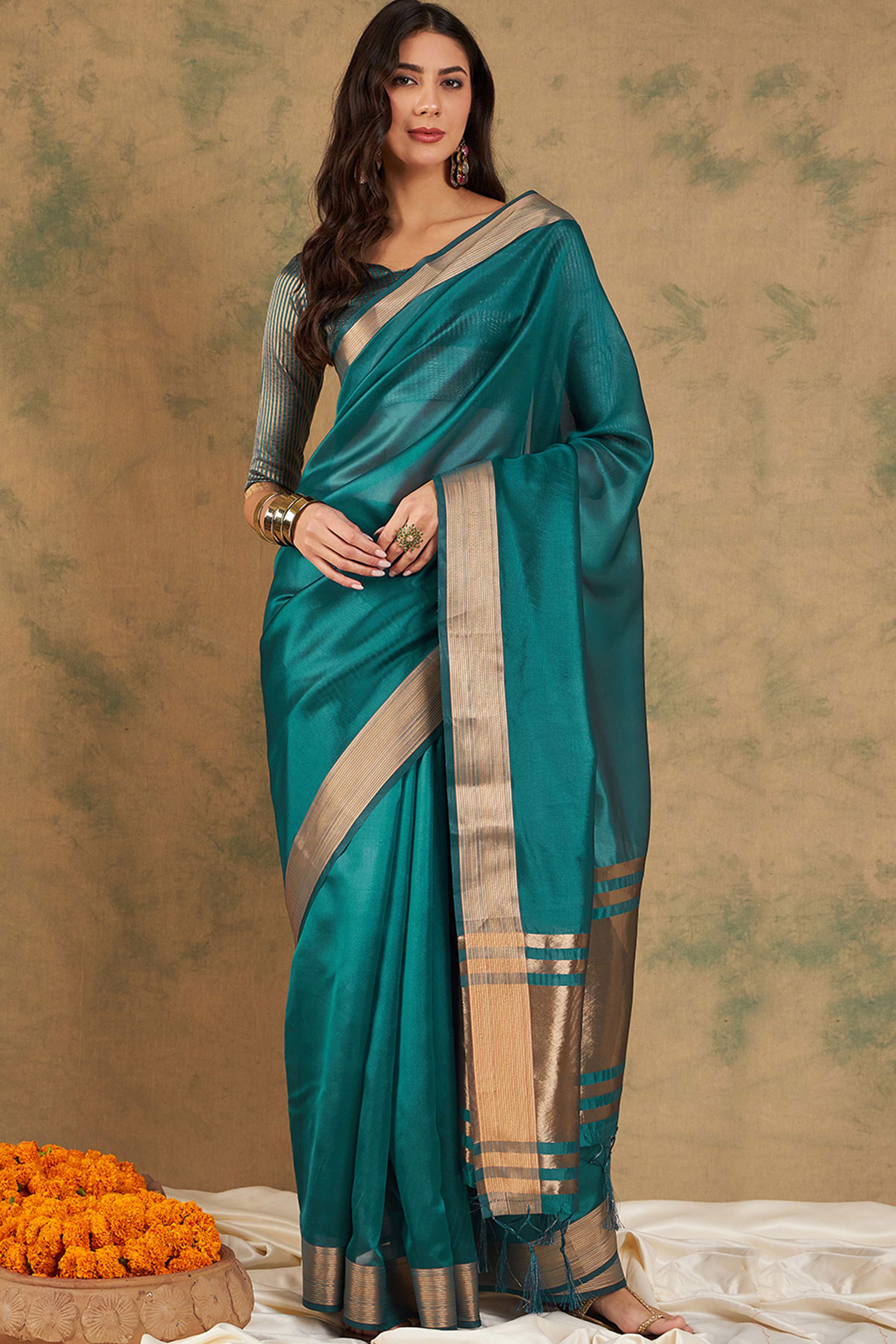 Teal Organza Saree In Organza With Delicate Weaving Border And Tassel Details