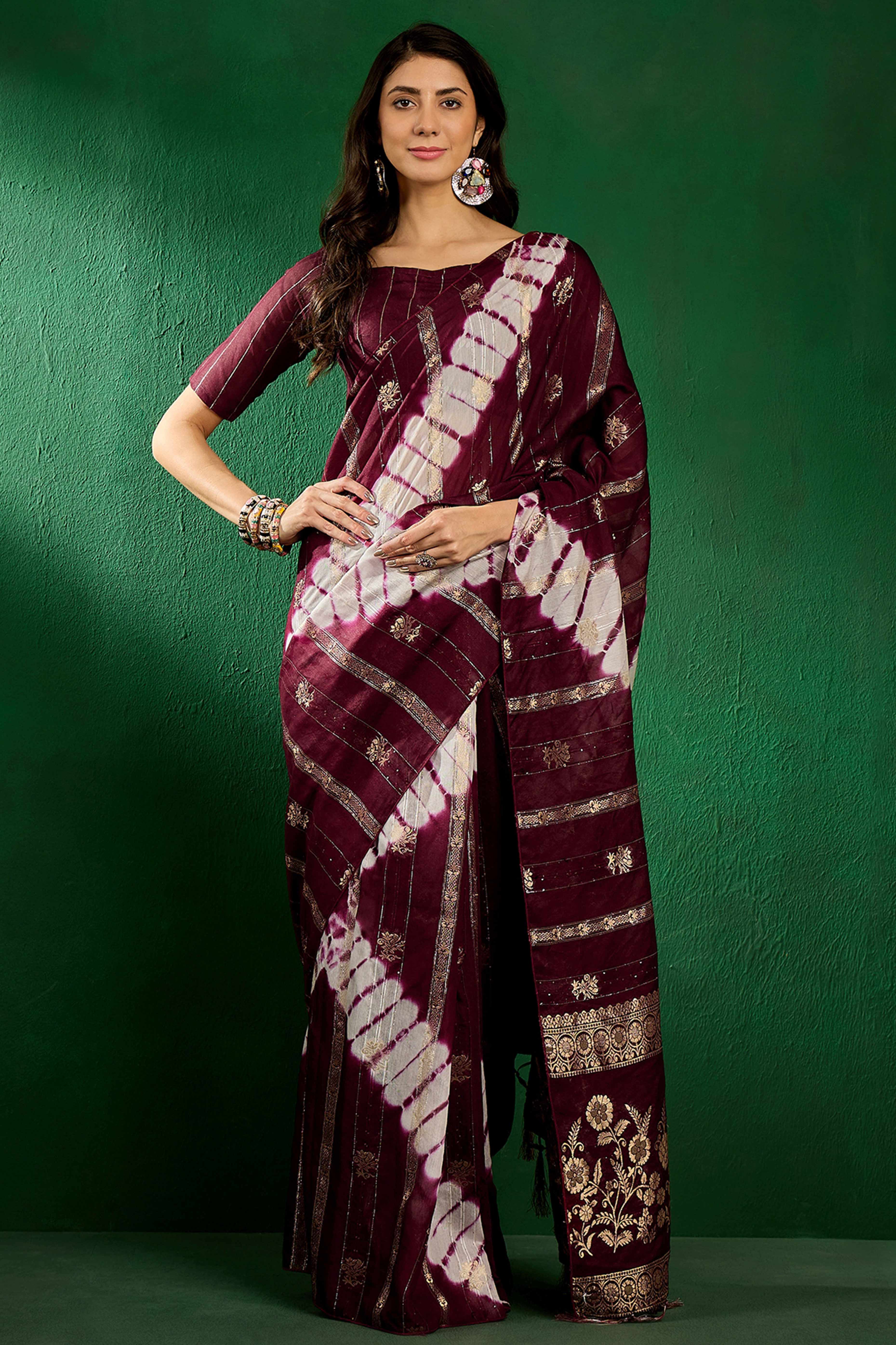 Wine Floral Woven Staple Cotton Blend Saree Highlighted With Sequins Embroidery & Tasselled Pallu