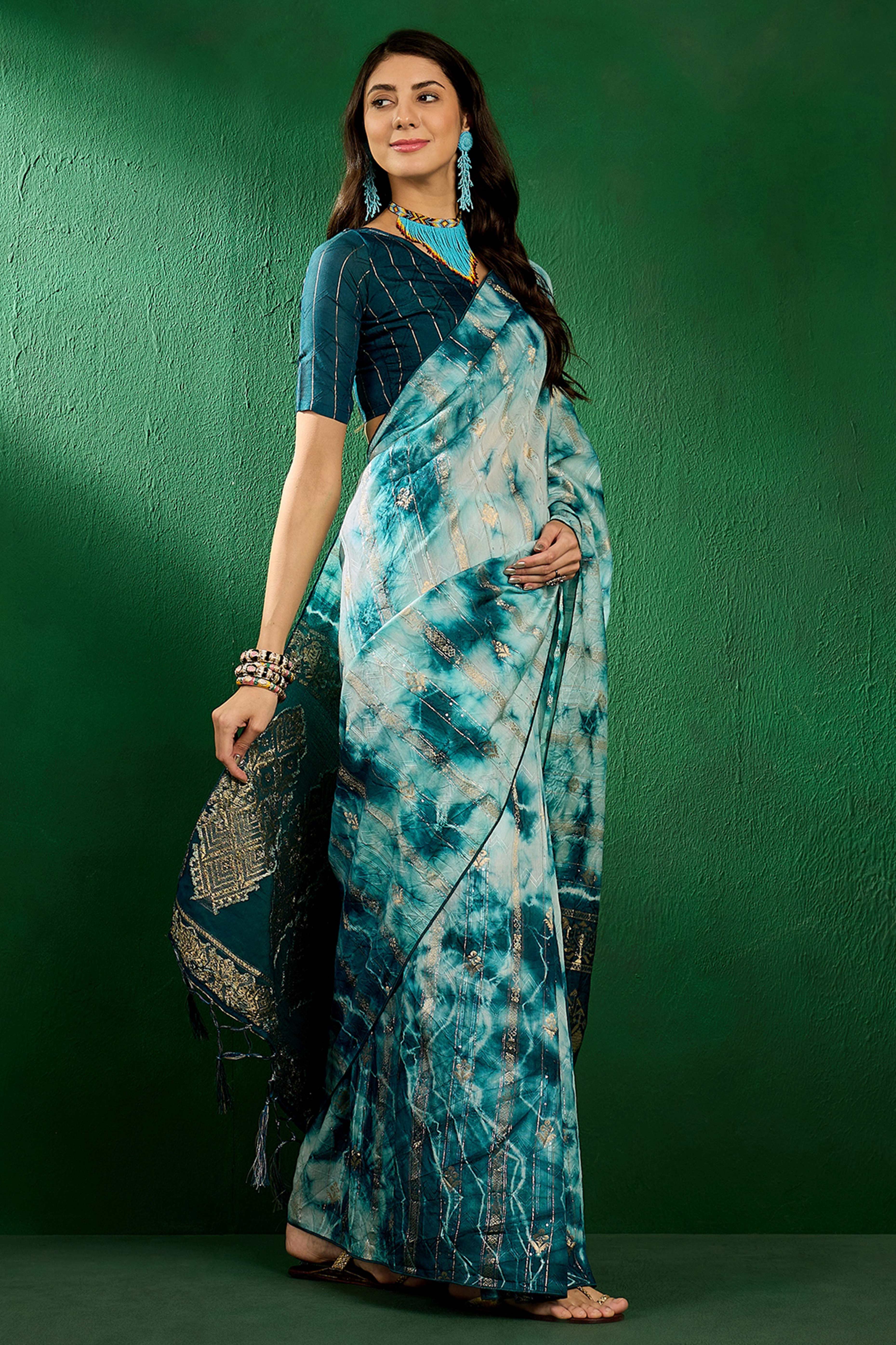 Floral Zari Woven Teal Saree In Cotton Blend With Sparkling Sequins & Elegant Tassel Pallu