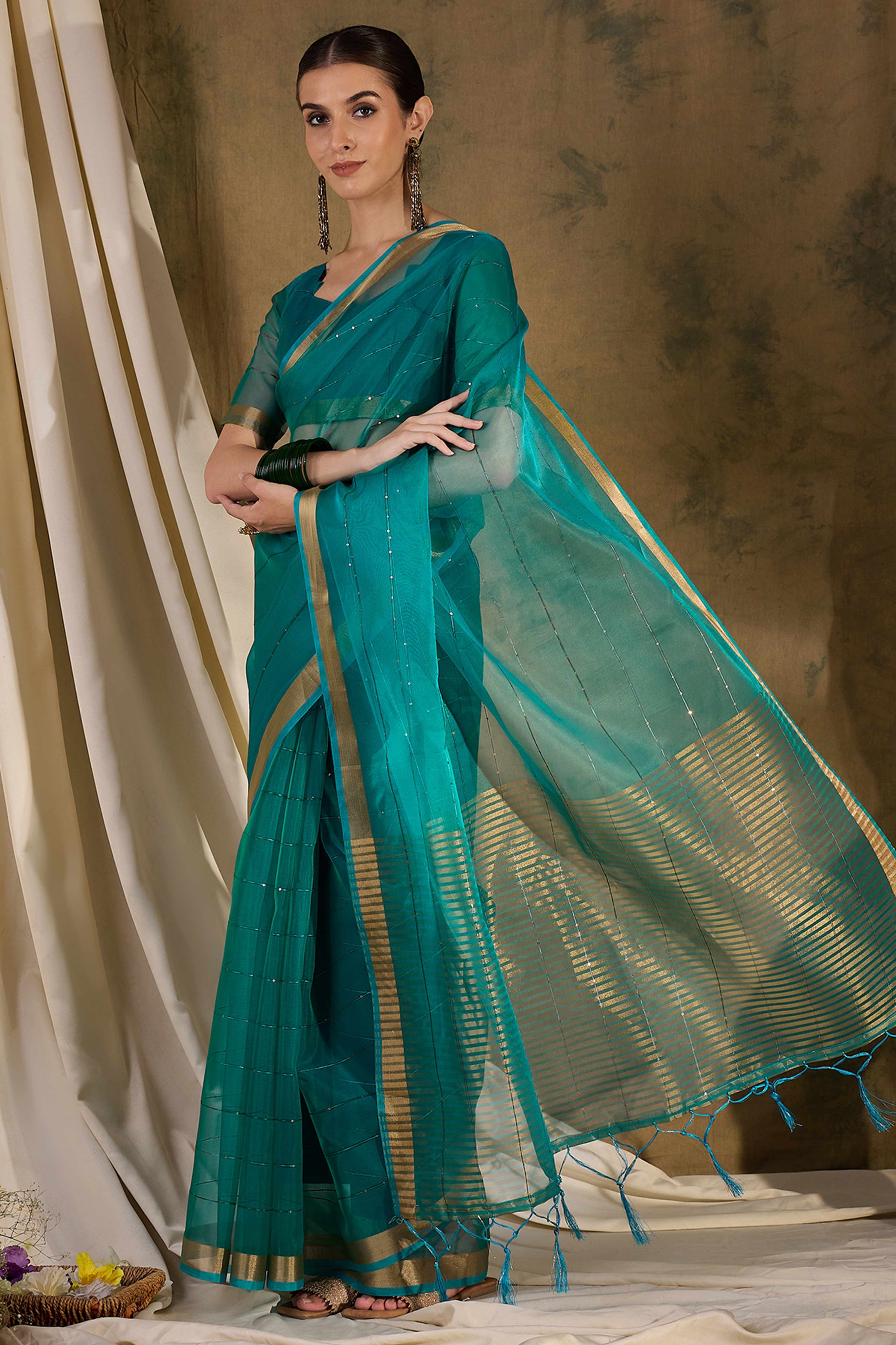 Teal Organza Silk Saree Featuring Shimmering Sequins Embroidery & Elegant Tasselled Pallu