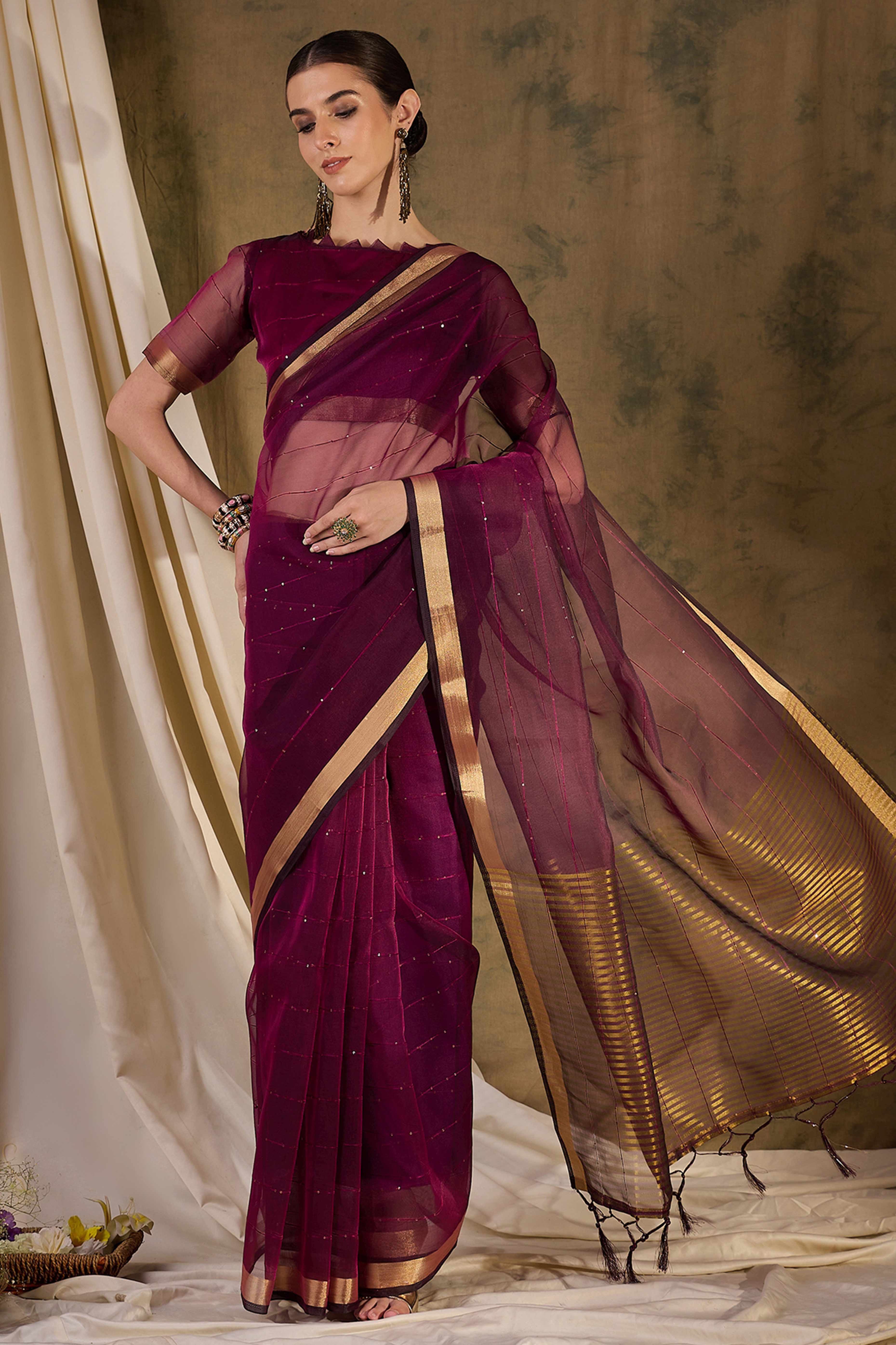 Wine Organza Silk Saree Featuring Shimmering Sequins Embroidery & Elegant Tasselled Pallu