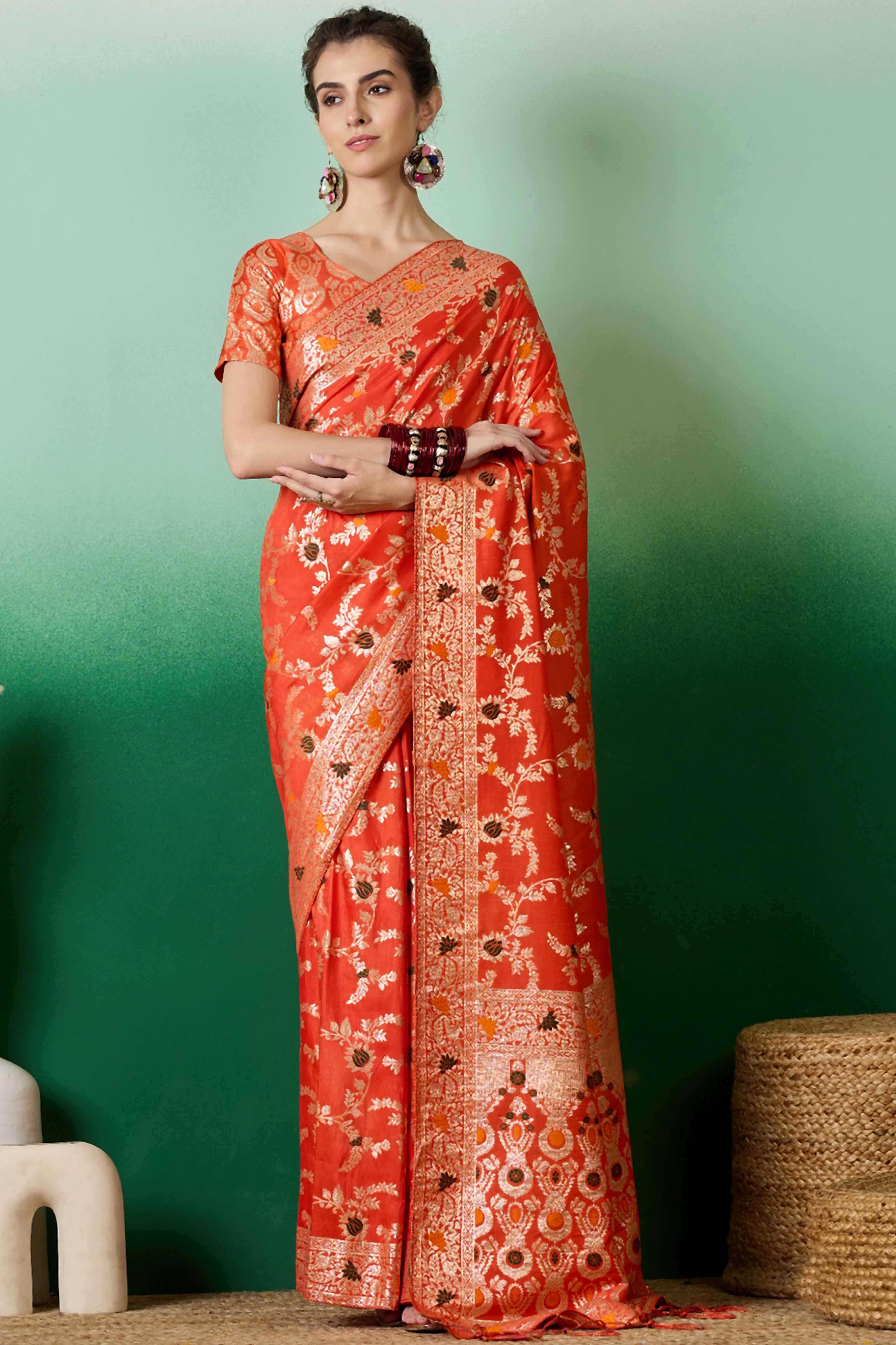 Orange Cotton Meena jacquard Saree Featuring Intricate Floral Weaving & Playful Tassels On The Pallu