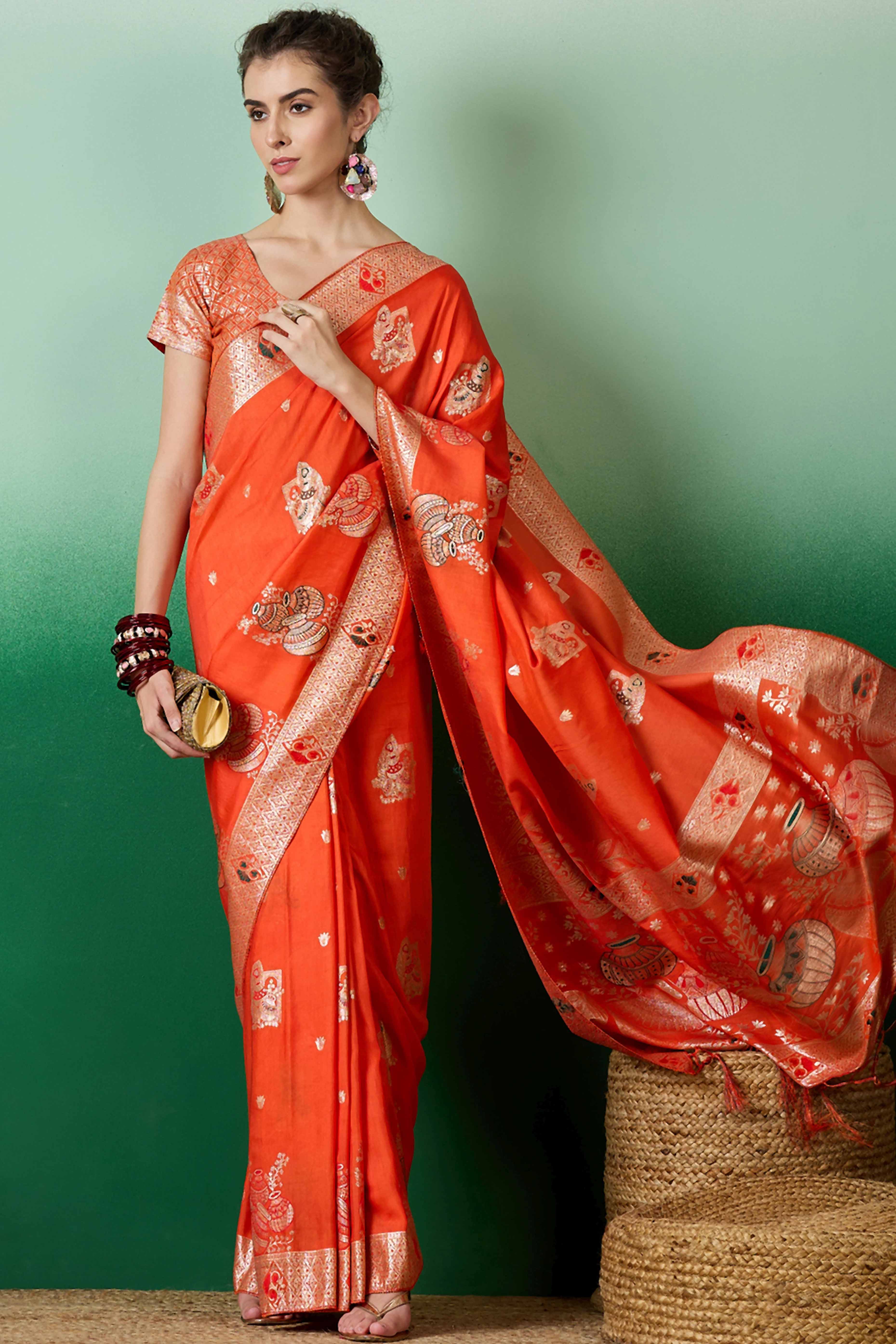 Orange Cotton Blend Saree Adorned With Floral Zari Weaving & Soft Tassel Accents