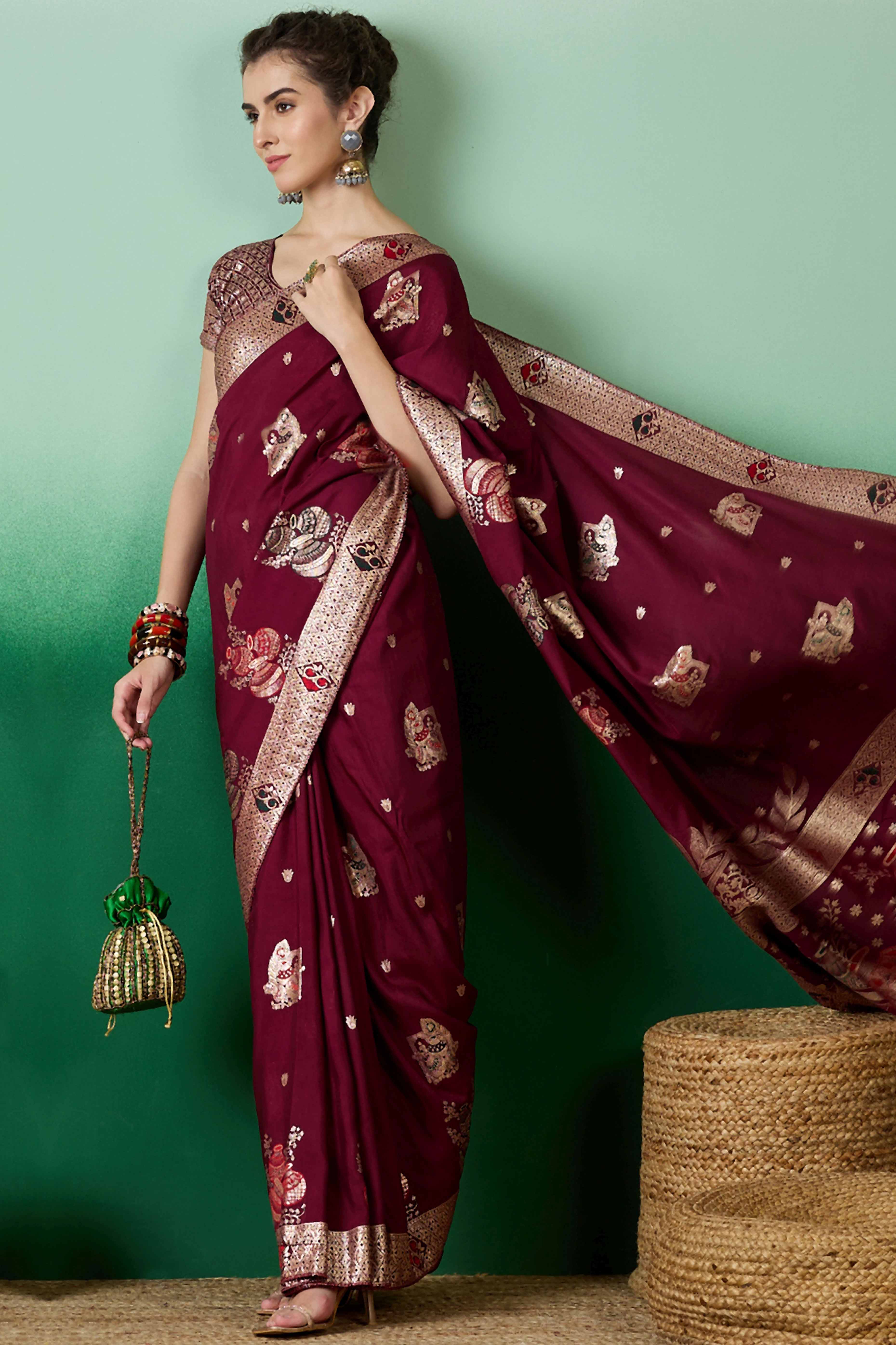 Wine Cotton Blend Saree Adorned With Floral Zari Weaving & Soft Tassel Accents