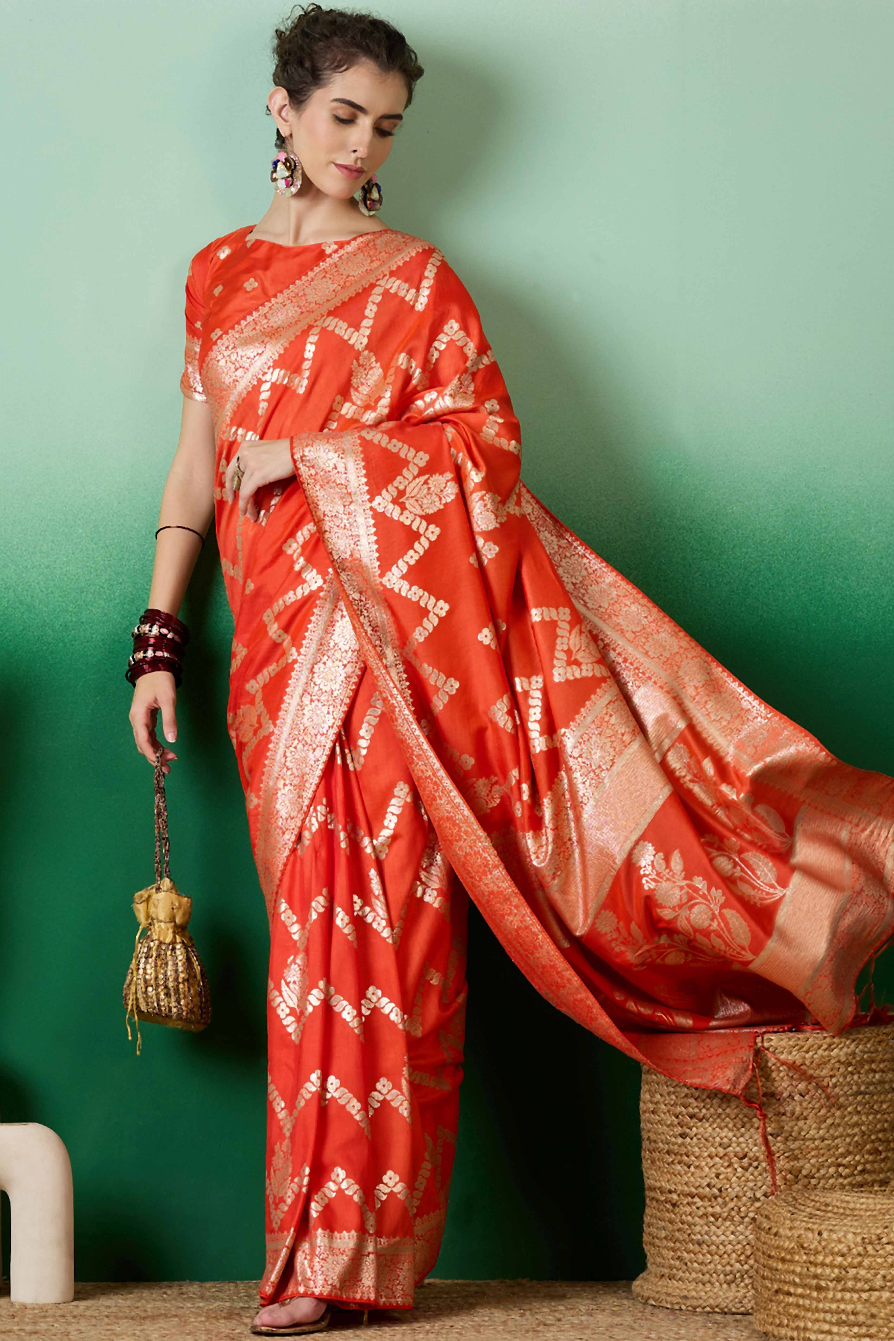 Orange Cotton Blend Jacquard Saree Adorned With Floral Weaving & Graceful Tassel Pallu
