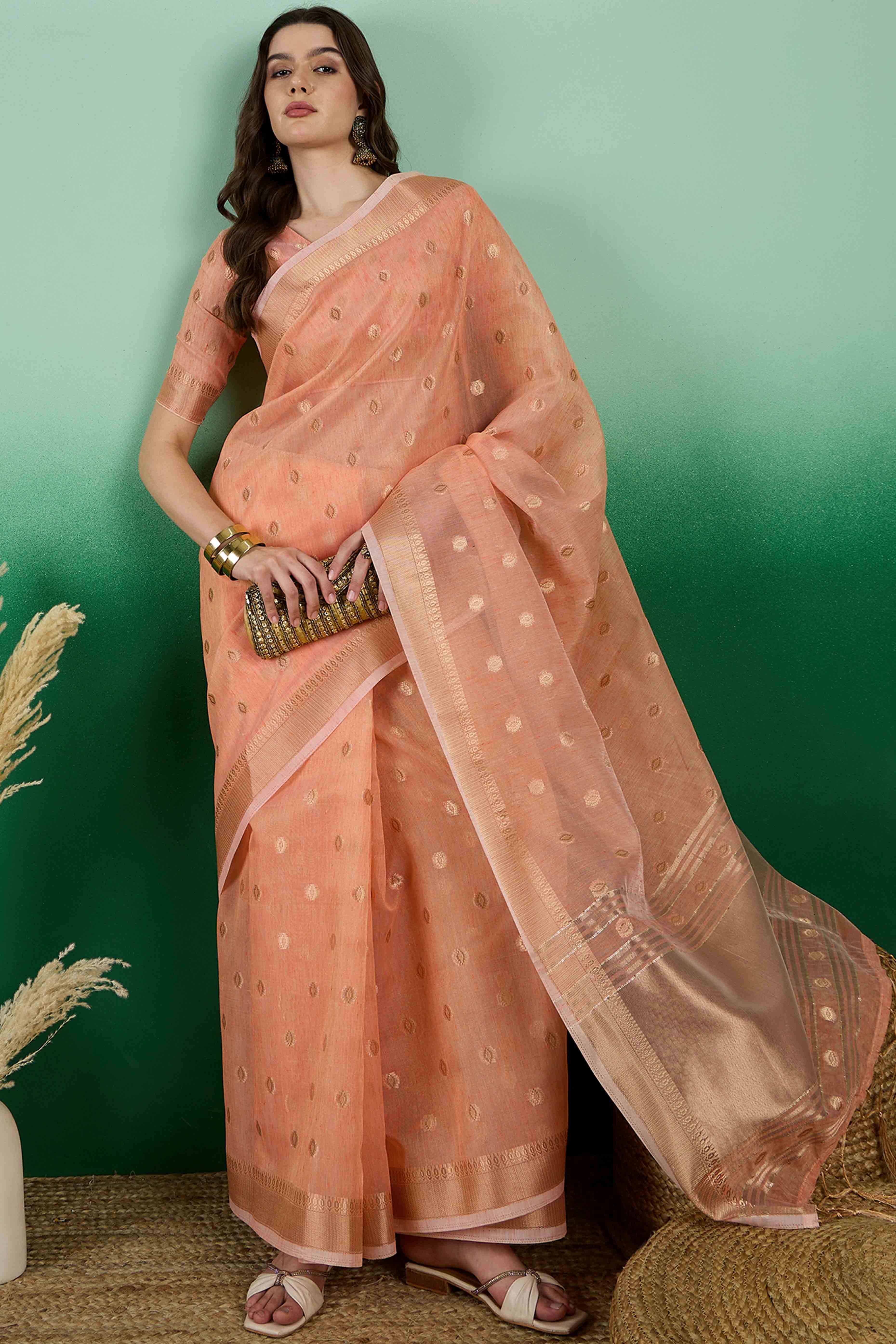 Orange Khadi Organza Saree Embellished With Traditional Zari Work & Tassels