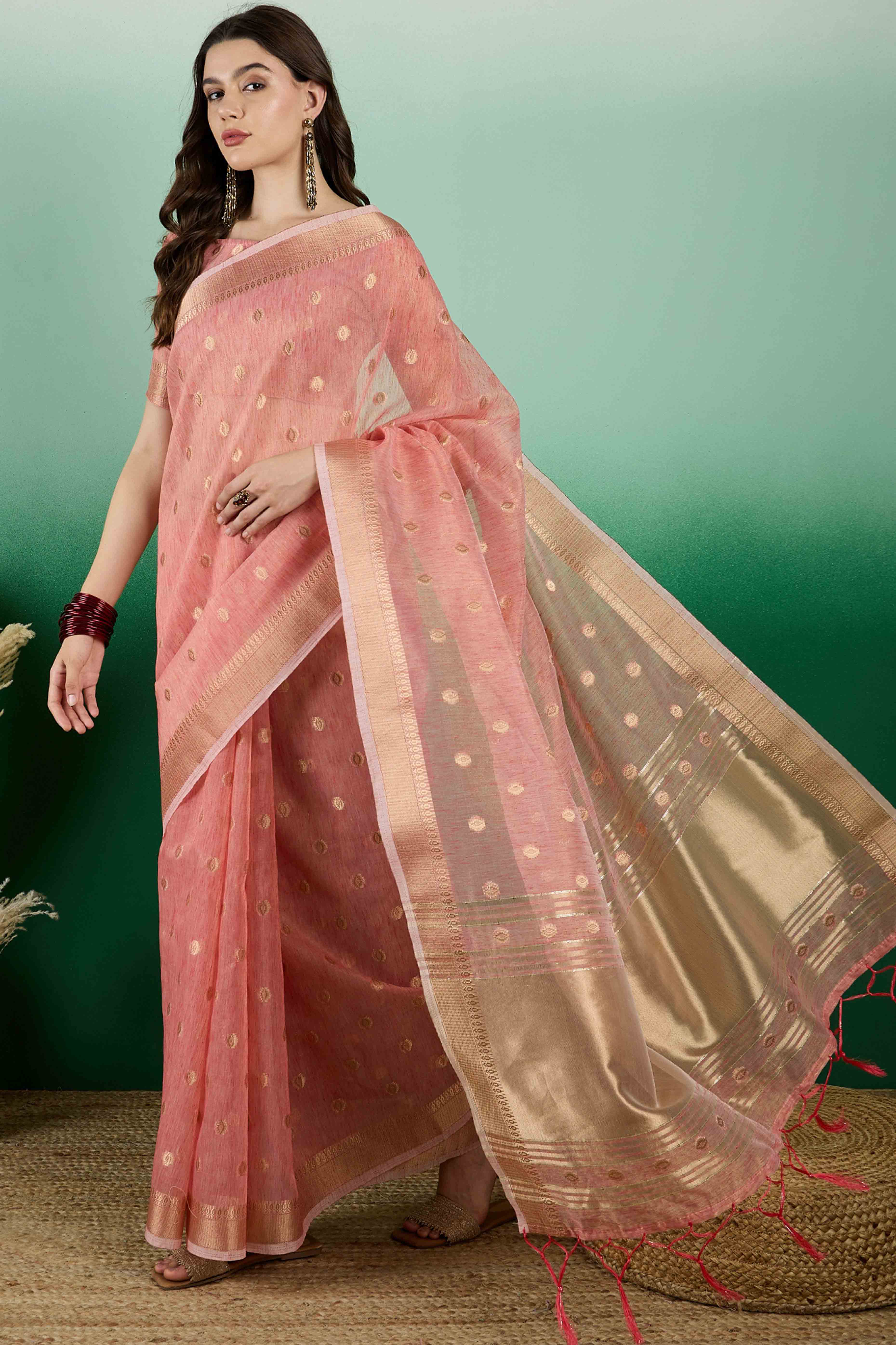 Peach Khadi Organza Saree Embellished With Traditional Zari Work & Tassels