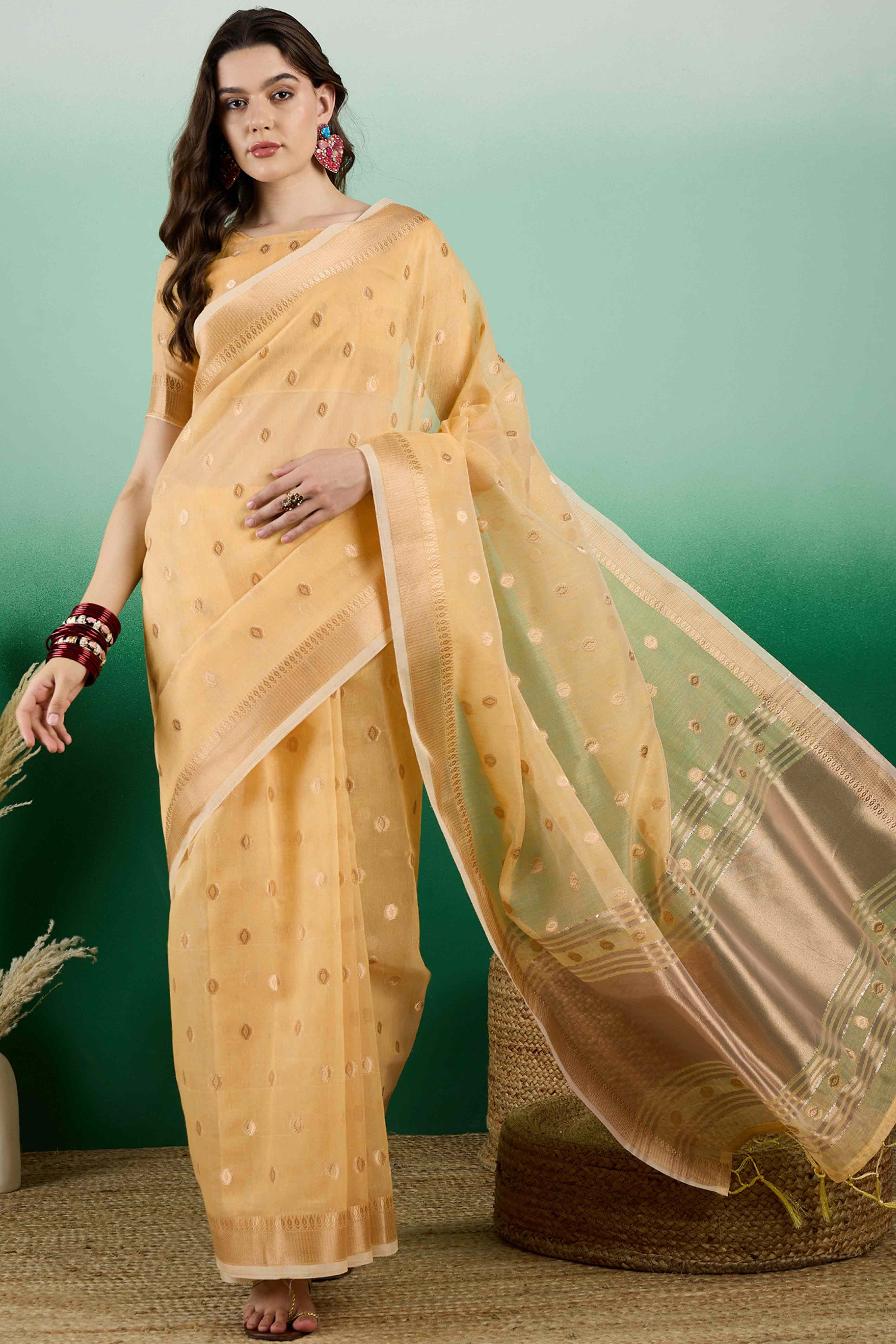 Yellow Khadi Organza Saree Embellished With Traditional Zari Work & Tassels