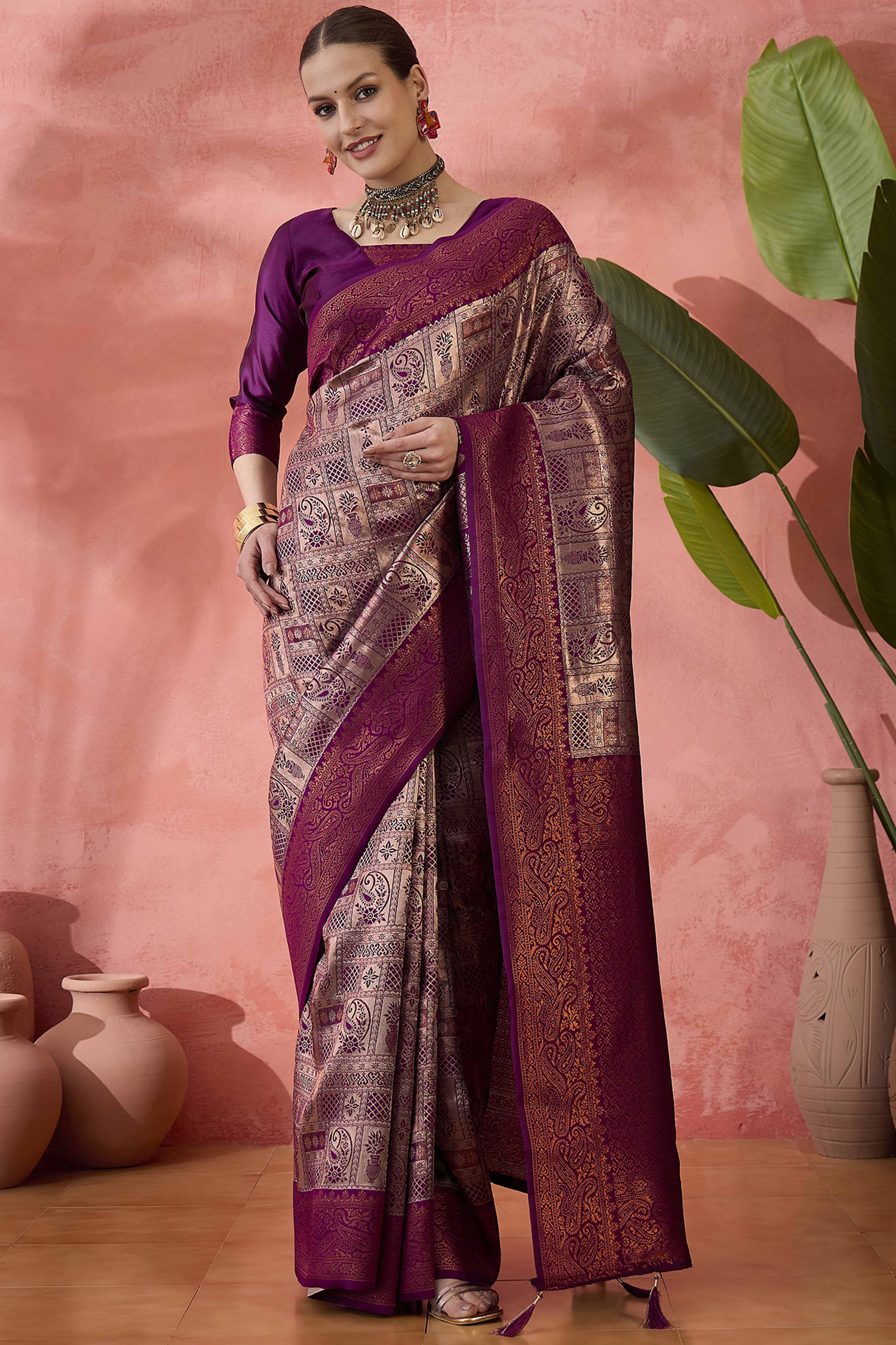 Wine Woven Poly Silk Blend Saree Featuring Floral & Paisley Motifs With Tassel Accents