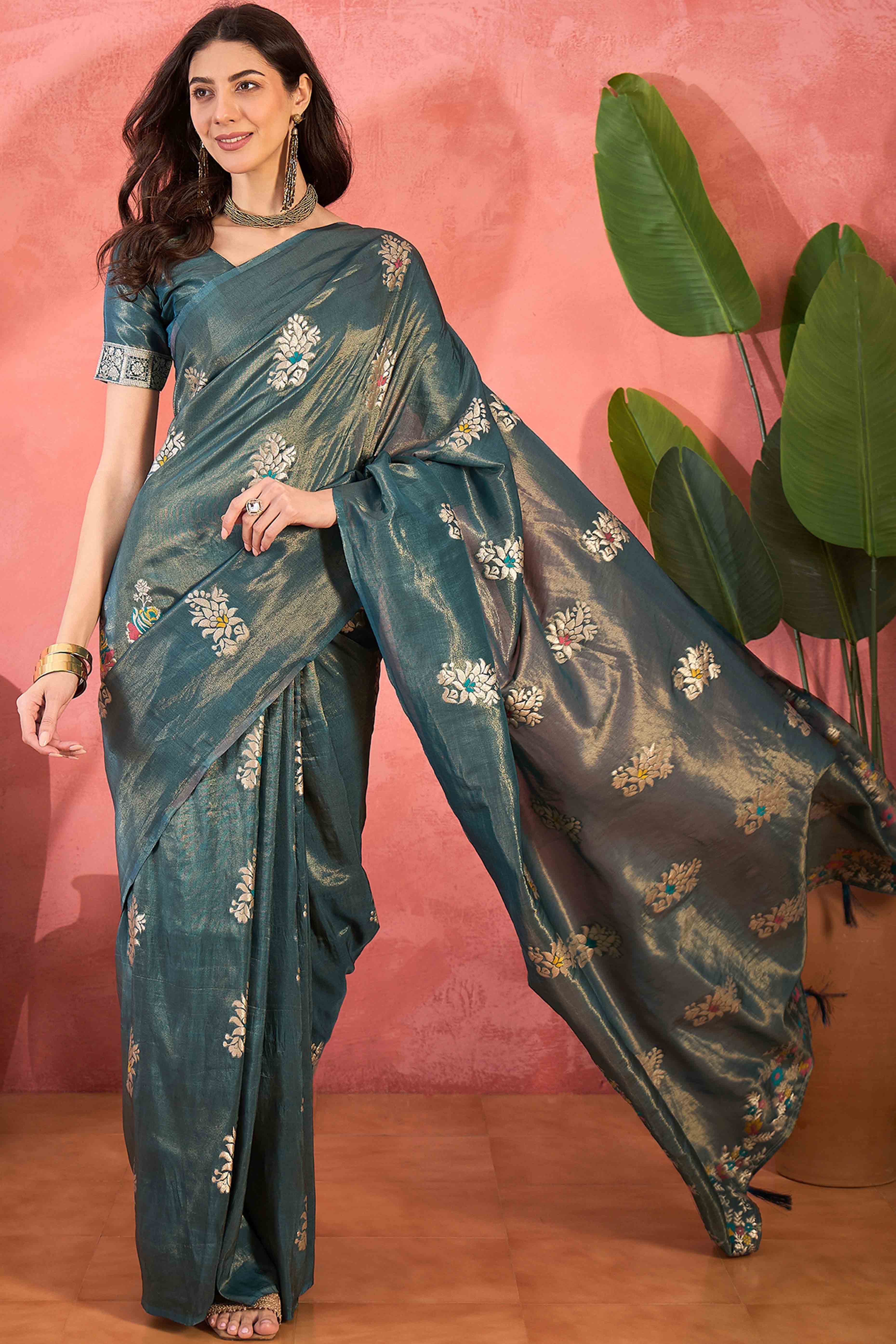 Teal Shimmer Saree Showcasing Floral Zari Weaving & A Tasselled Pallu
