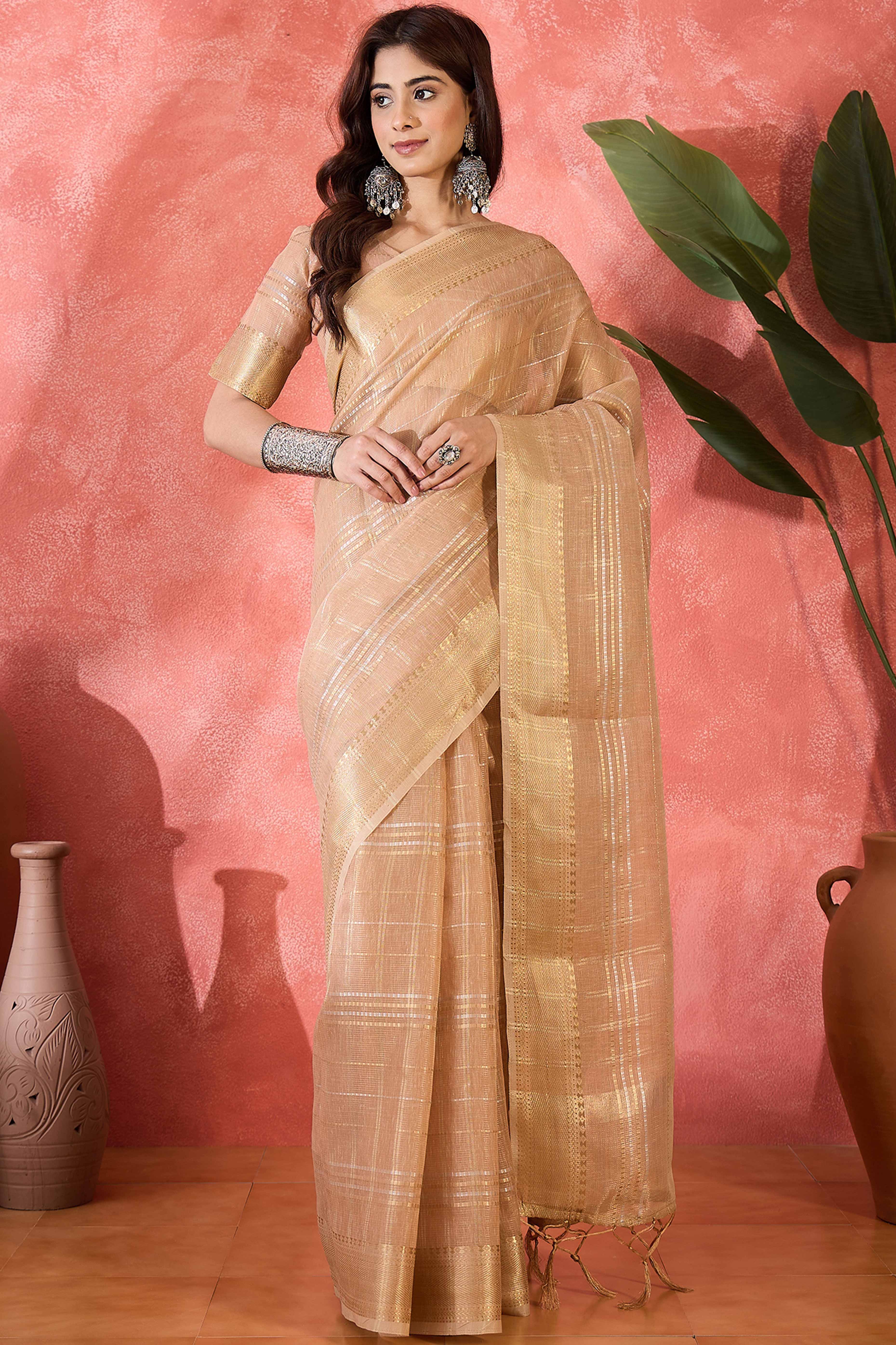 Light Peach Zari Woven Khadi Organza Saree Featuring Classic Checks & Tassel Detailing