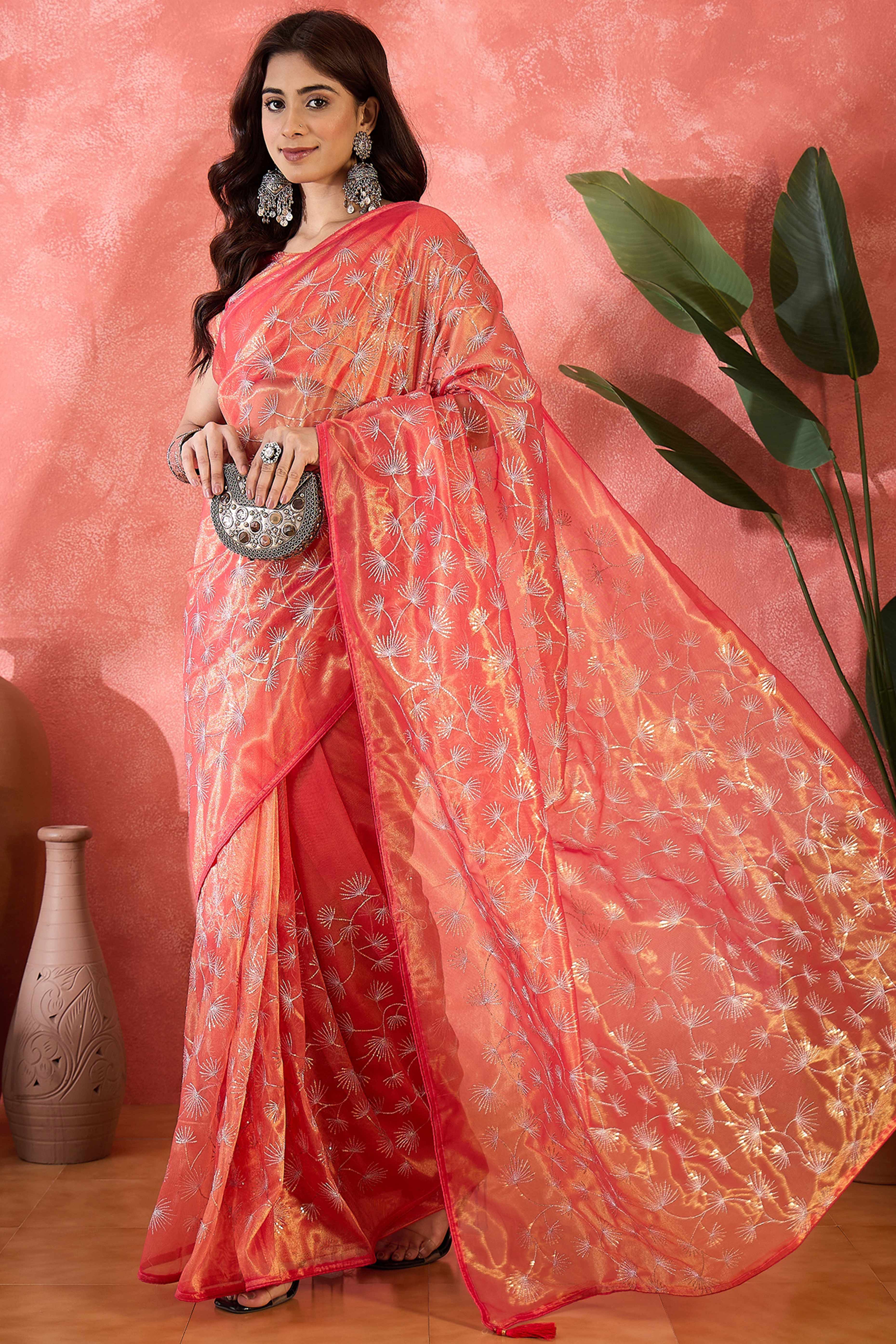 Rust Orange Twill Net Saree With Intricate Floral Sequin Work & Flowing Tassel Pallu