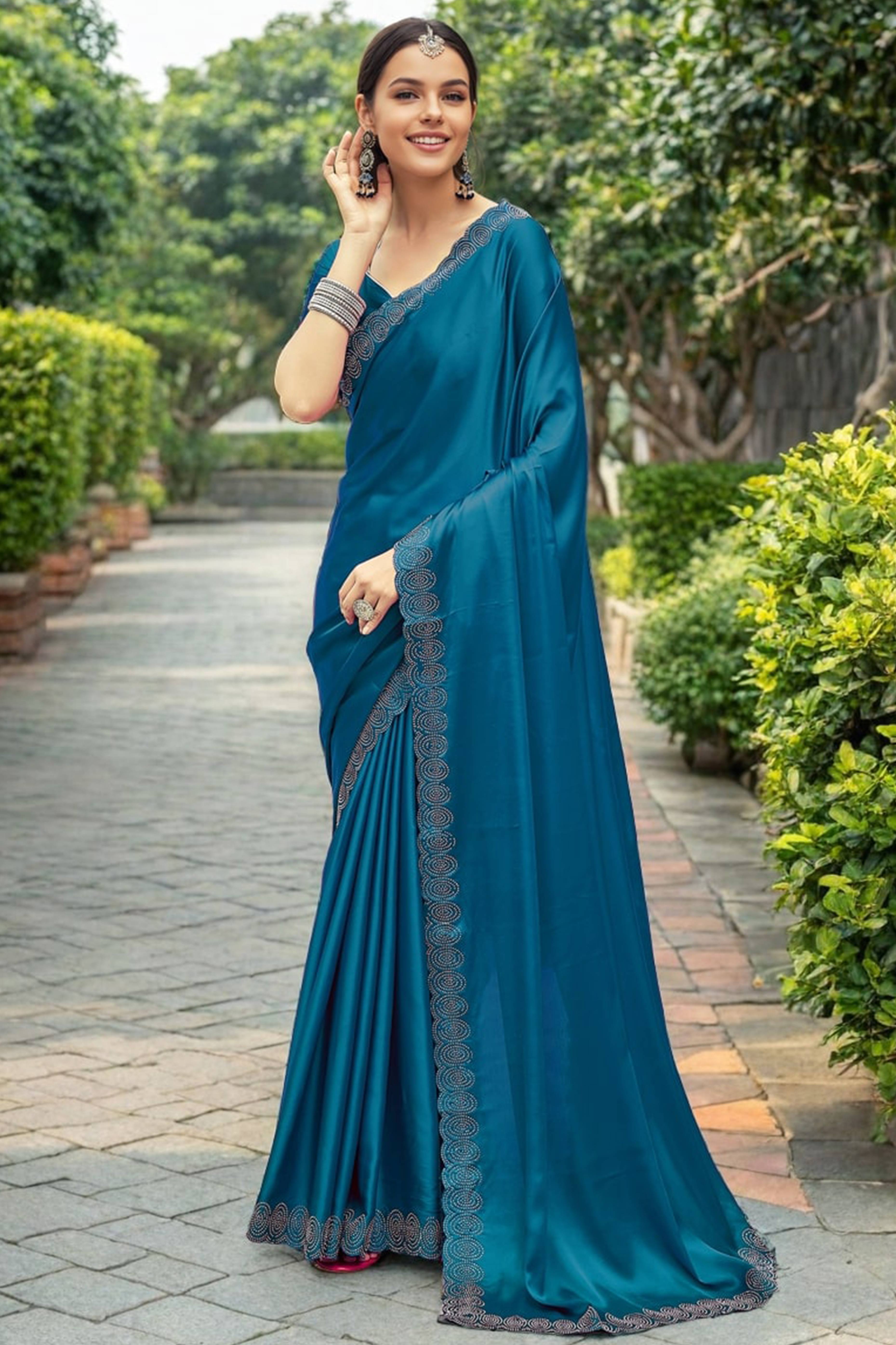 Teal Blue Solid Rangoli Dola Silk Saree Featuring Sparkling Swarovski Work Border