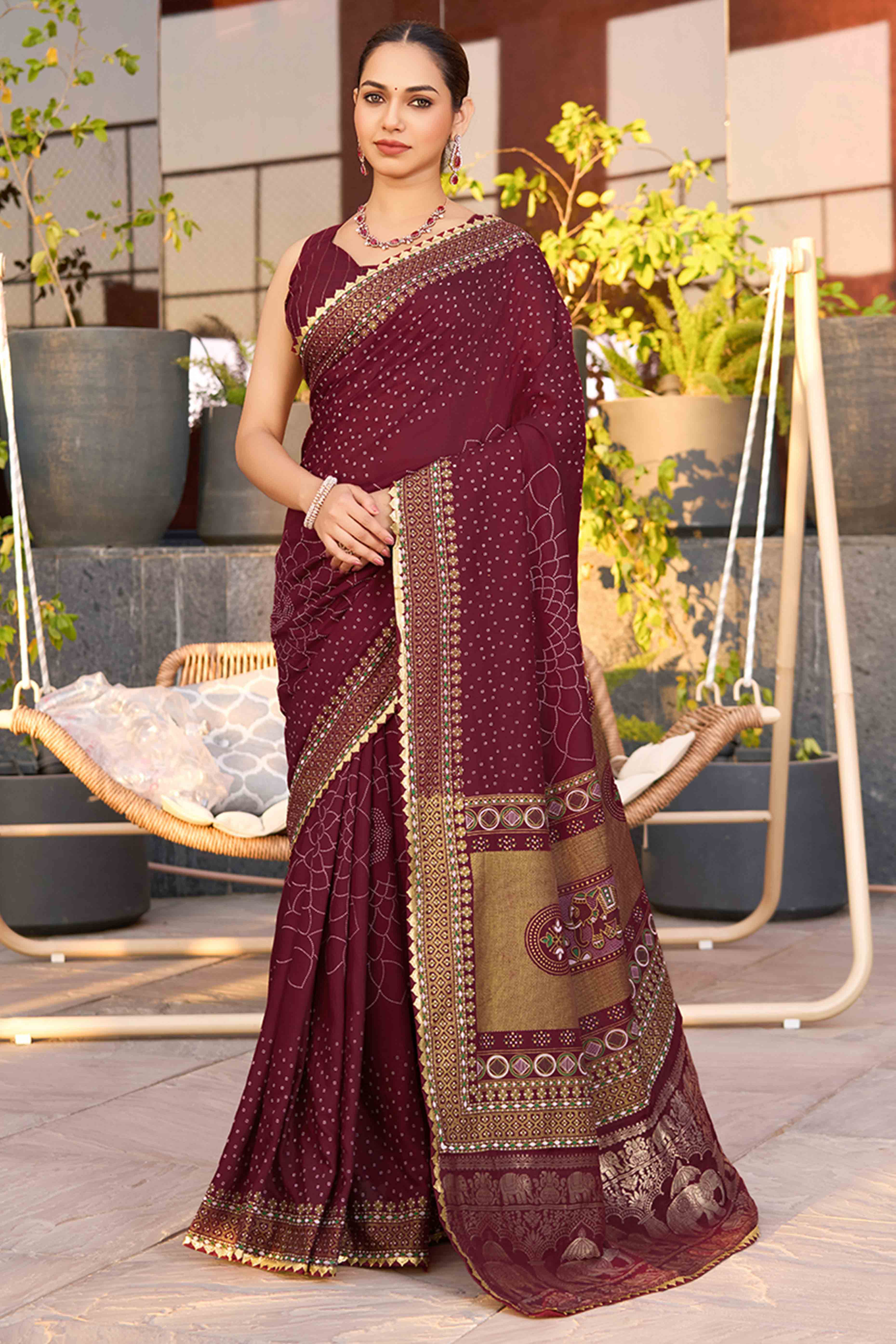 Feel The Luxury Of Maroon Bandhani Foil Printed Cotton Silk Sarree With Lace Border