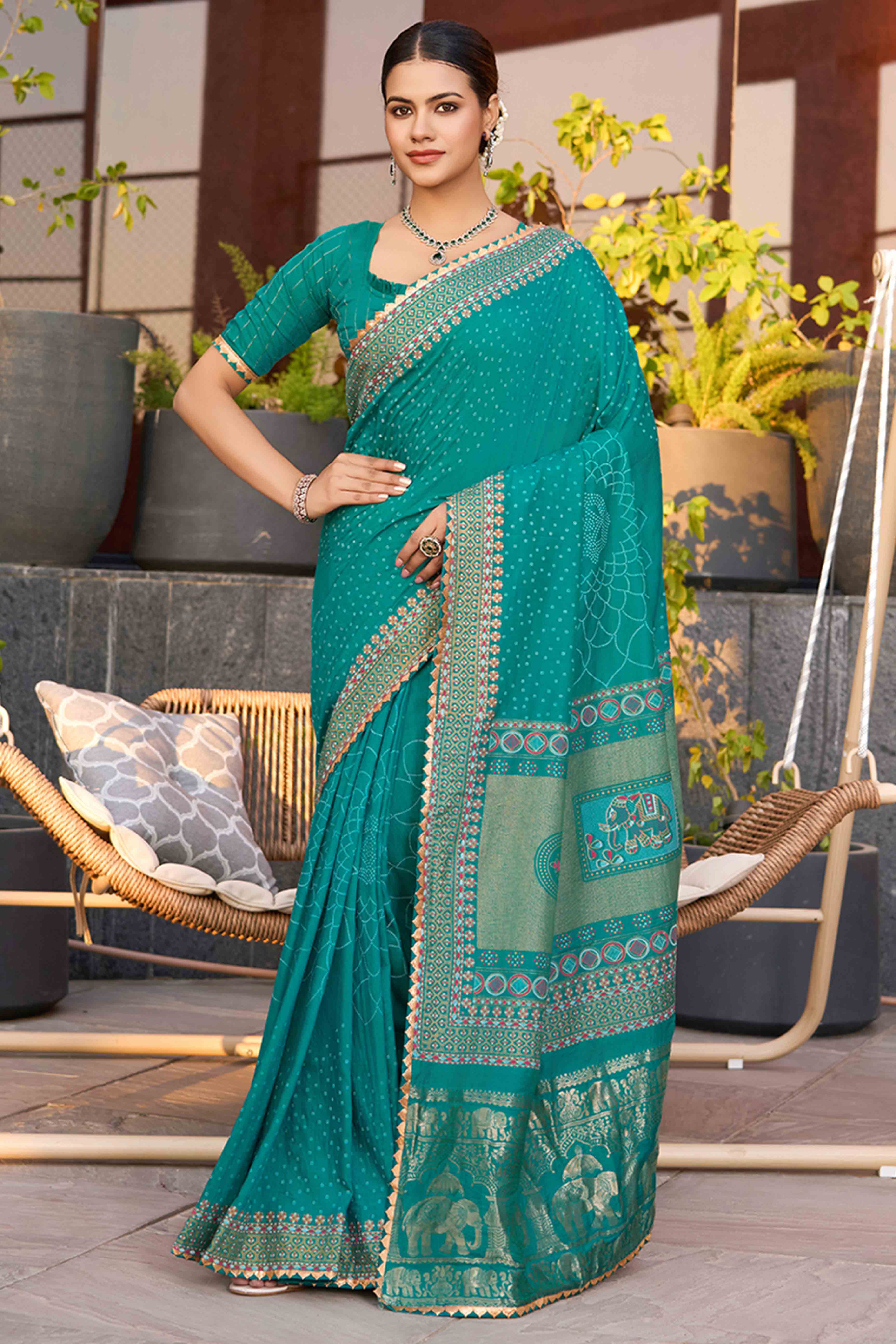 Drape Yourself In The Charm Of Rama Blue Bandhani Foil Printed Cotton Silk Sarree With Lace Border