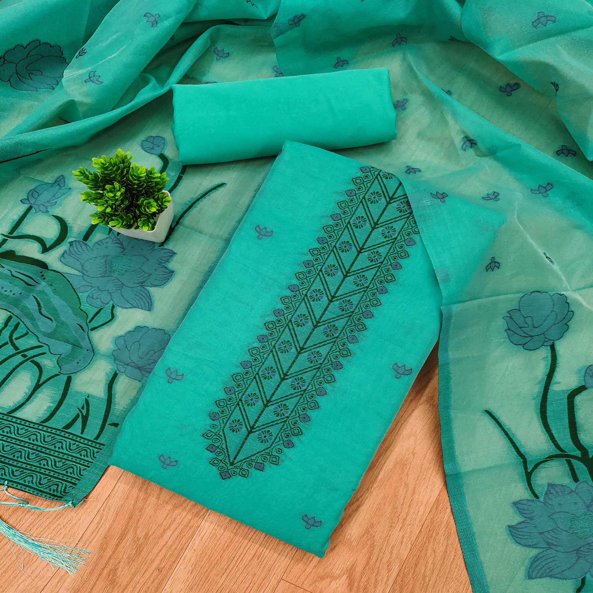 Sea Green Ethnic Dress Material Showcasing Handloom Style Floral Zari Weaving