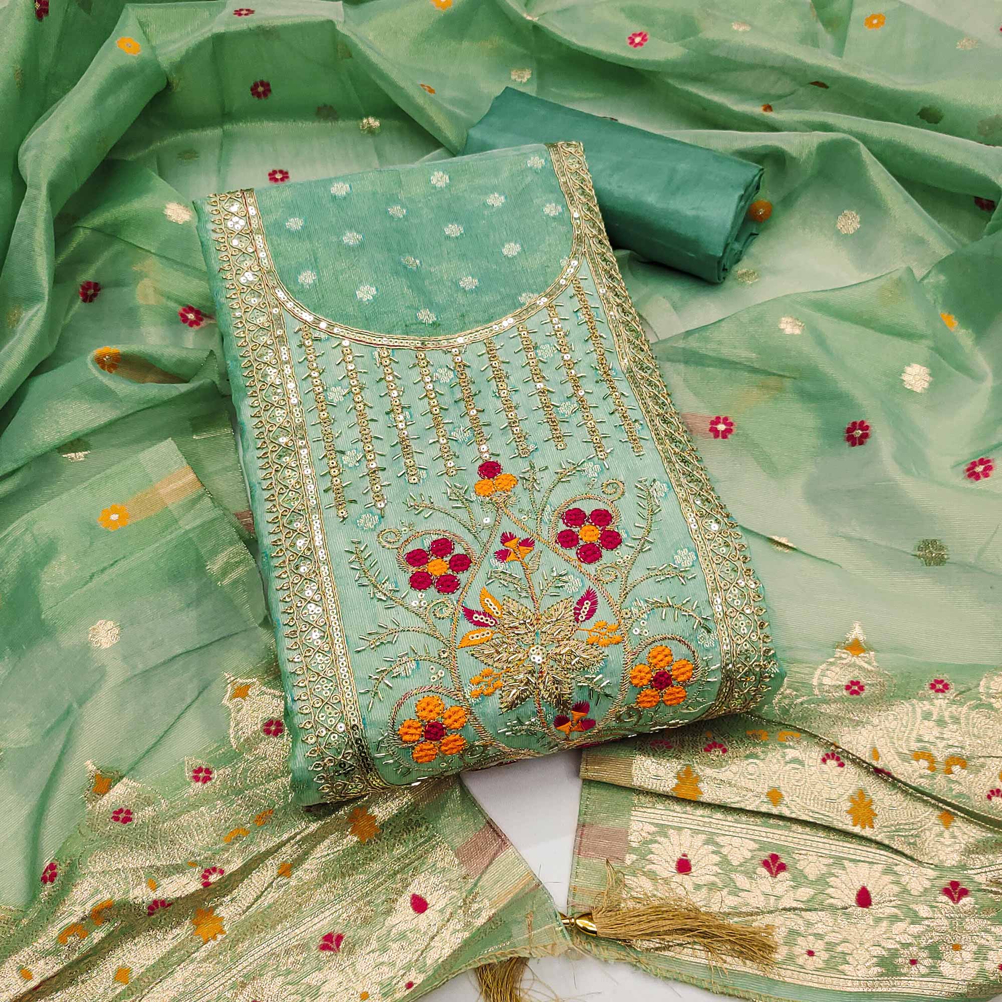 Green Shimmer Dress Material Adorned With Graceful Floral Weaving & Delicate Sequins Embroidery