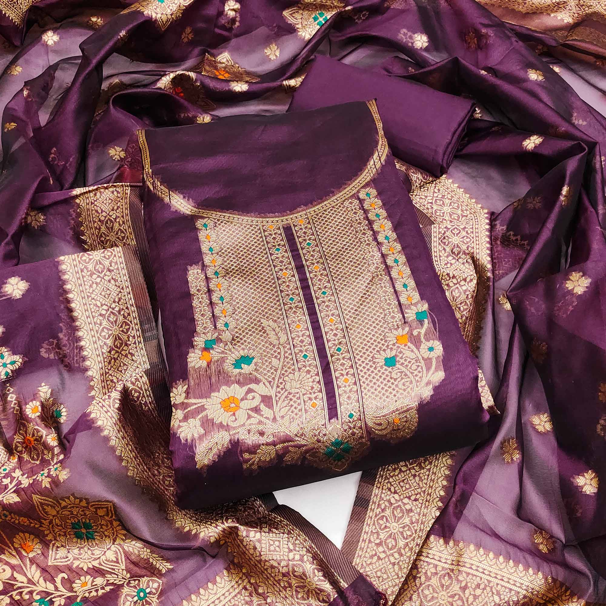 Wine Organza Silk Dress Material Adorned With Exquisite Floral Zari Weaving Work