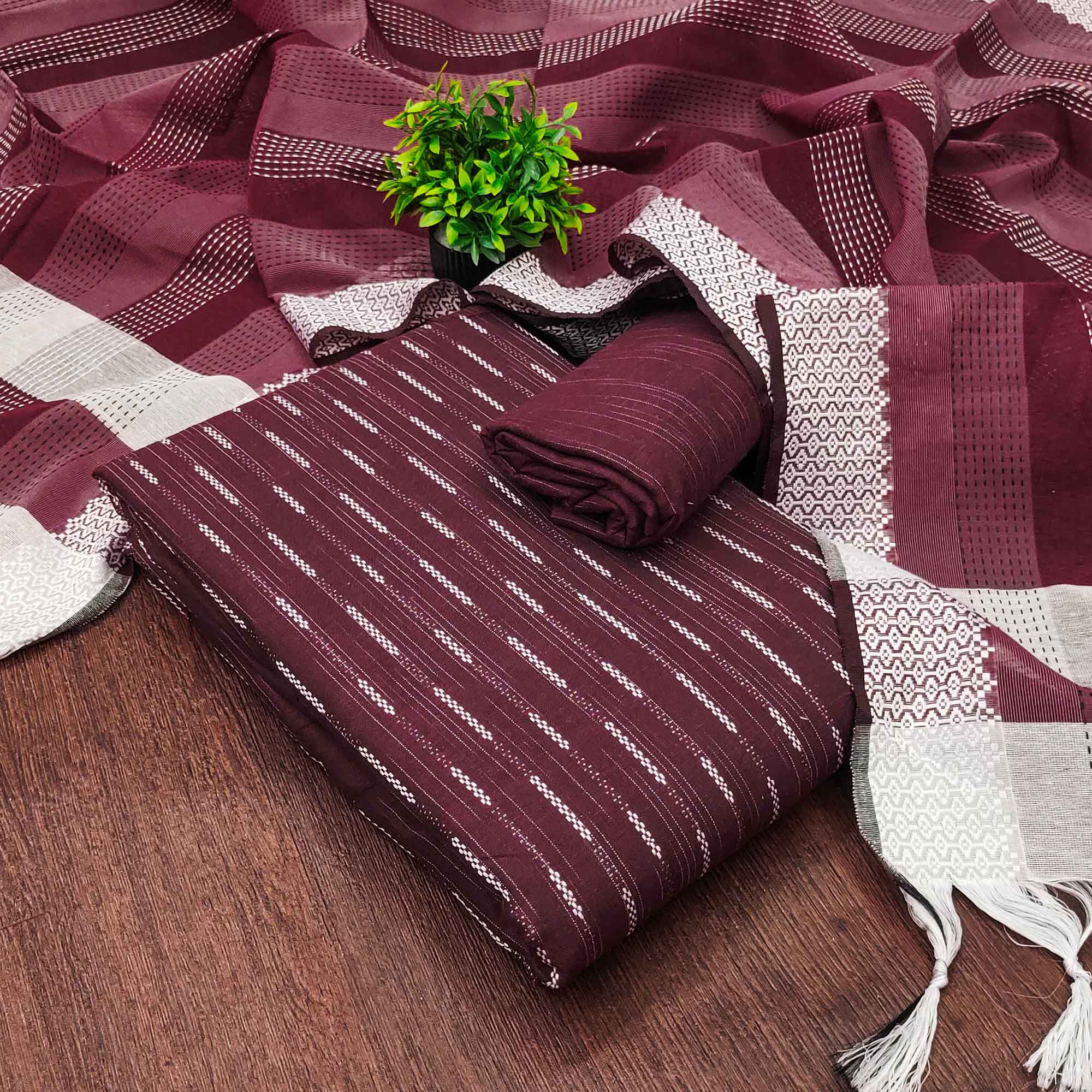 Wine Poly Cotton Blend Dress Material Adorned With Striped Weaving Work