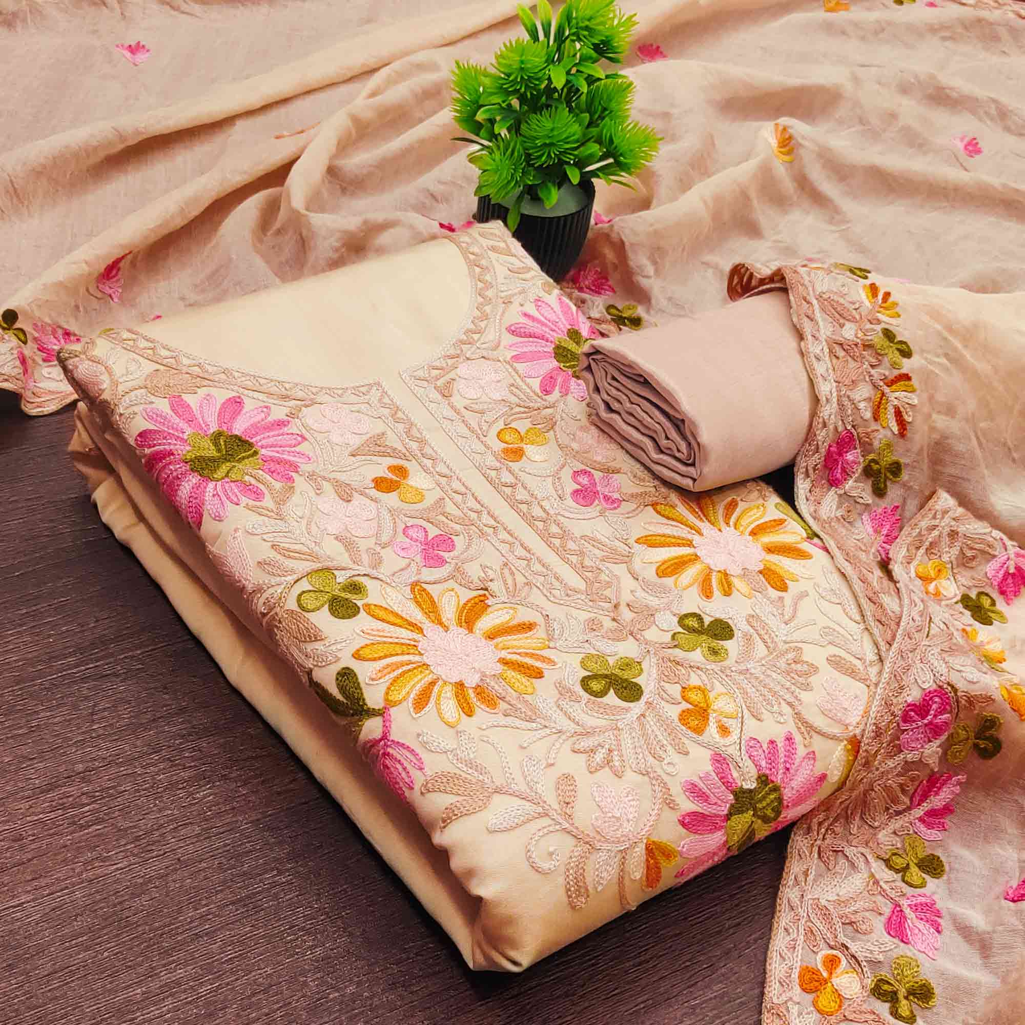 Chikoo Designer Roman Art Silk Dress Material Adorned With Floral Thread Embroidery Work