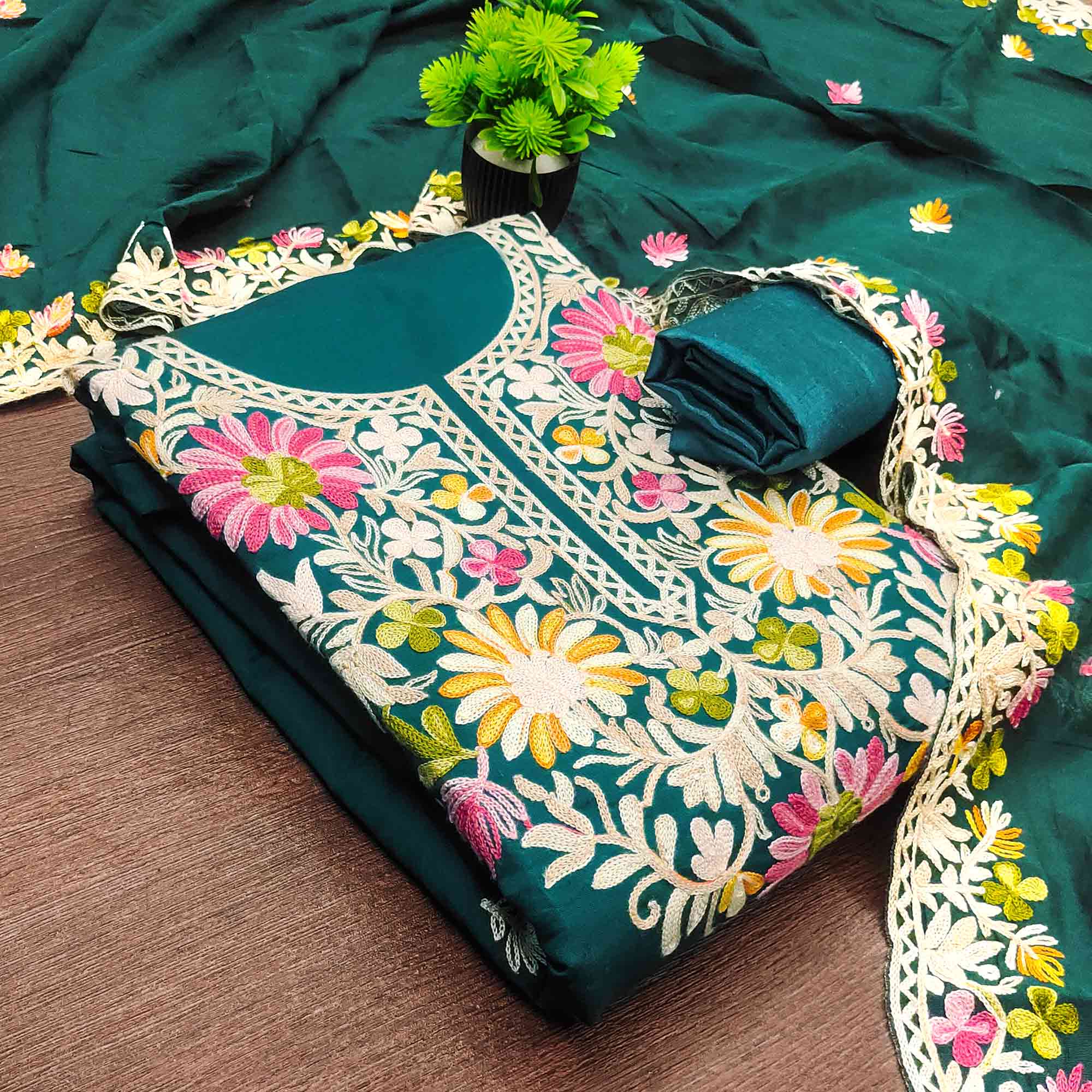 Teal Designer Roman Art Silk Dress Material Adorned With Floral Thread Embroidery Work