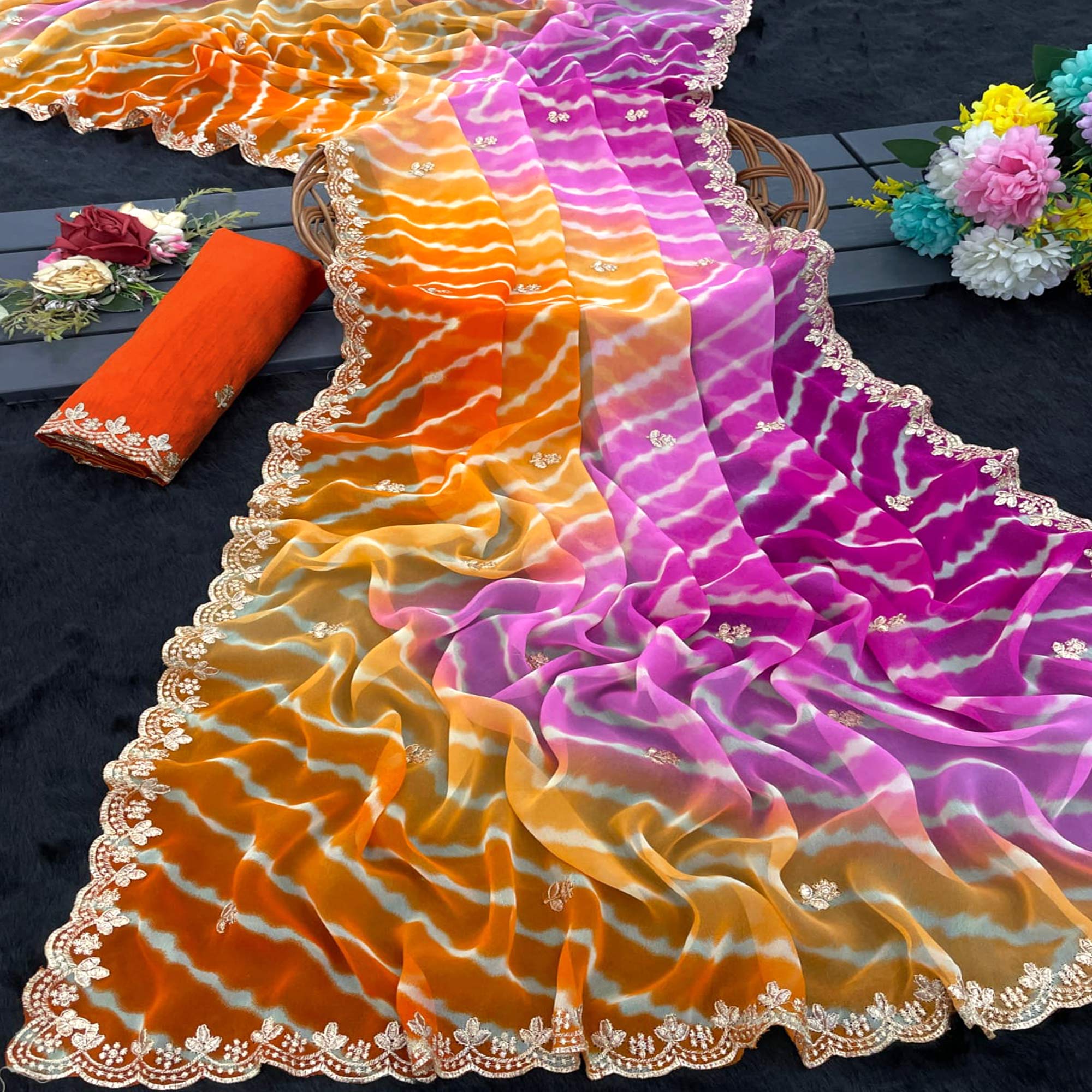 Festive Georgette Saree in Orange & Purple with Ethnic Leheriya Print and Fine Embroidery