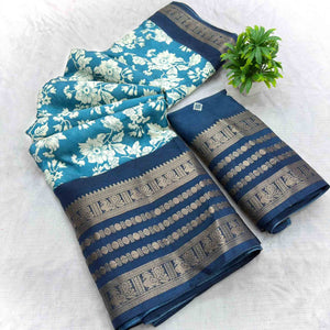 Luxurious Teal Blue Floral Print Dola Silk Saree With Intricate Peacock Motif Zari Woven Border