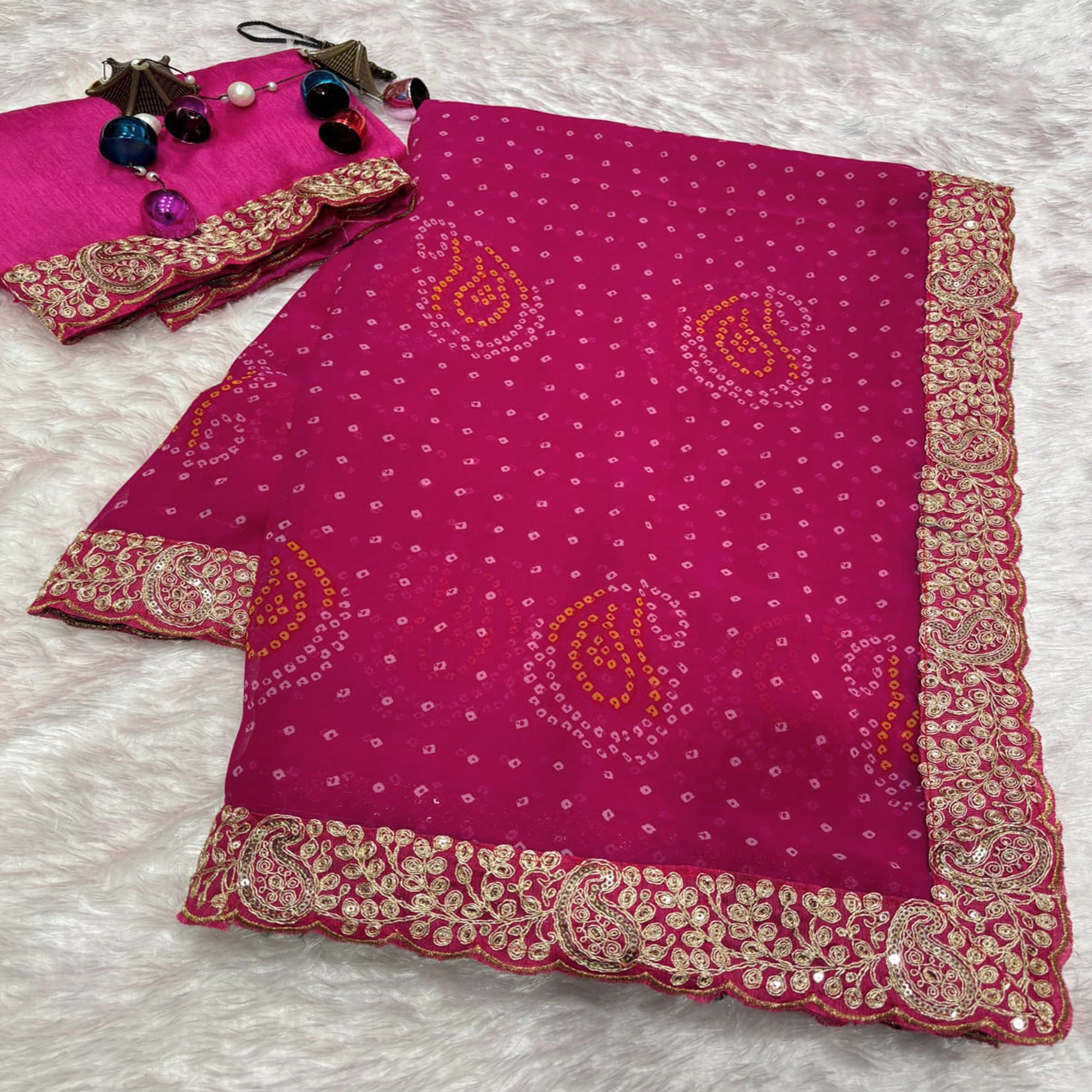 Pink Bandhani Printed Georgette Saree With Embroidered Border