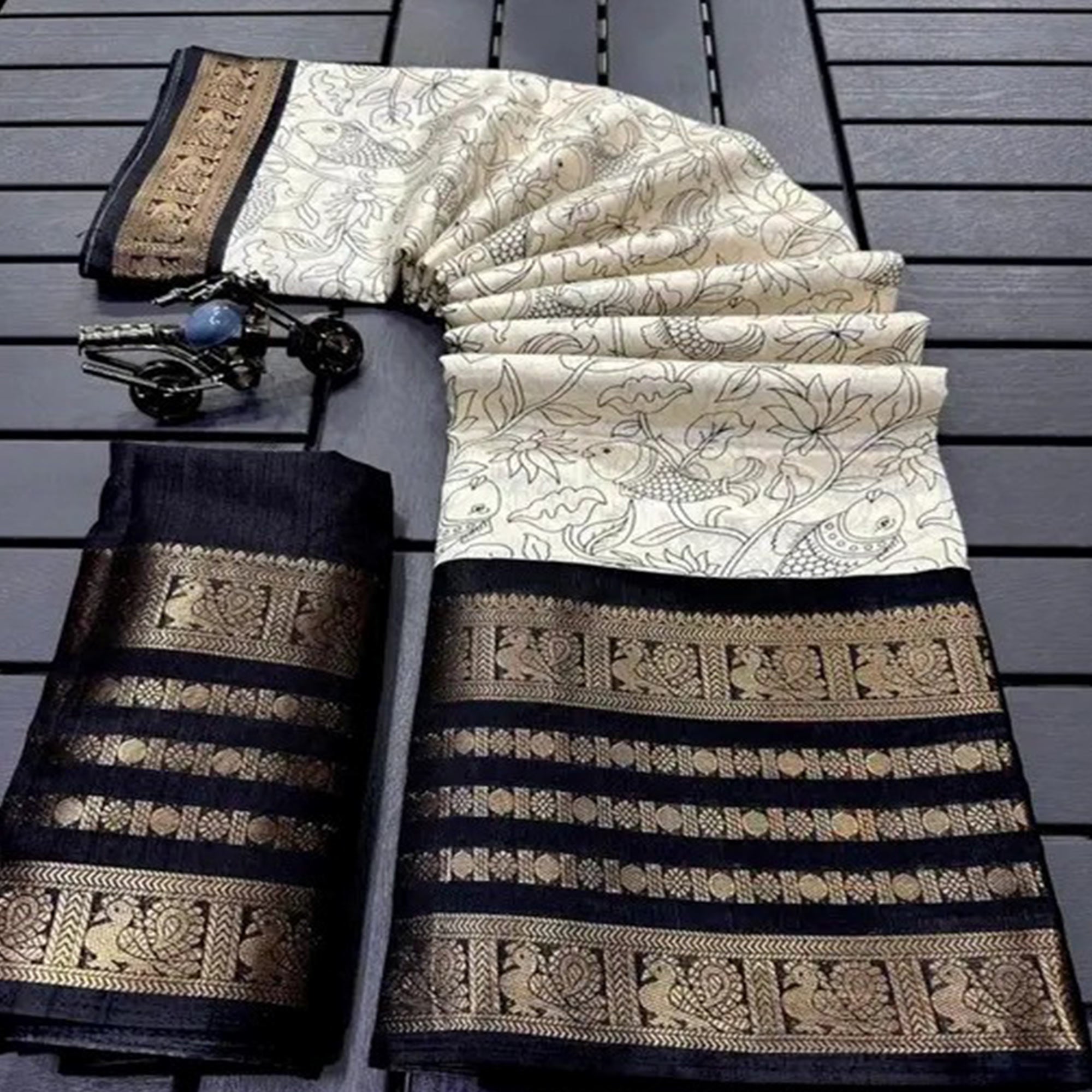 Off White & Black Floral Printed Dola Silk Saree With Zari Border