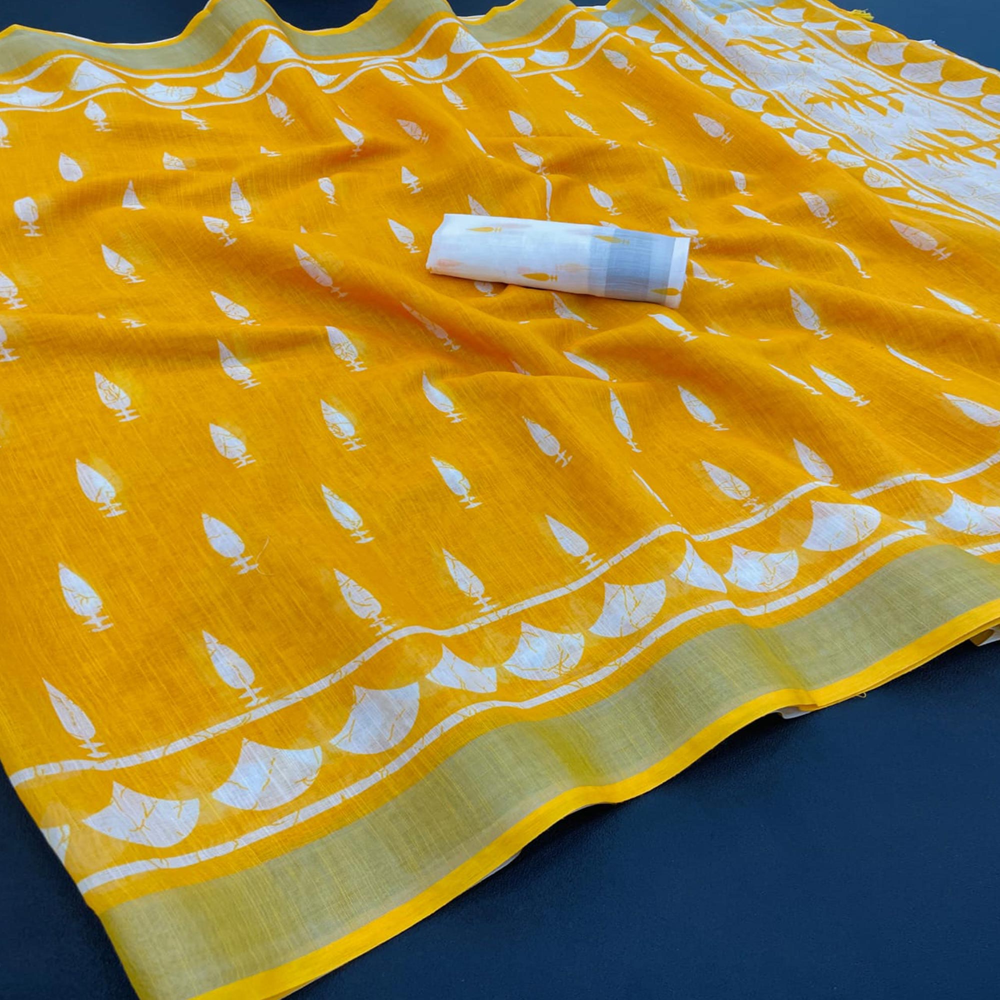 Vibrant Yellow Printed Linen Cotton Saree Featuring Artistic Tassel Detailing
